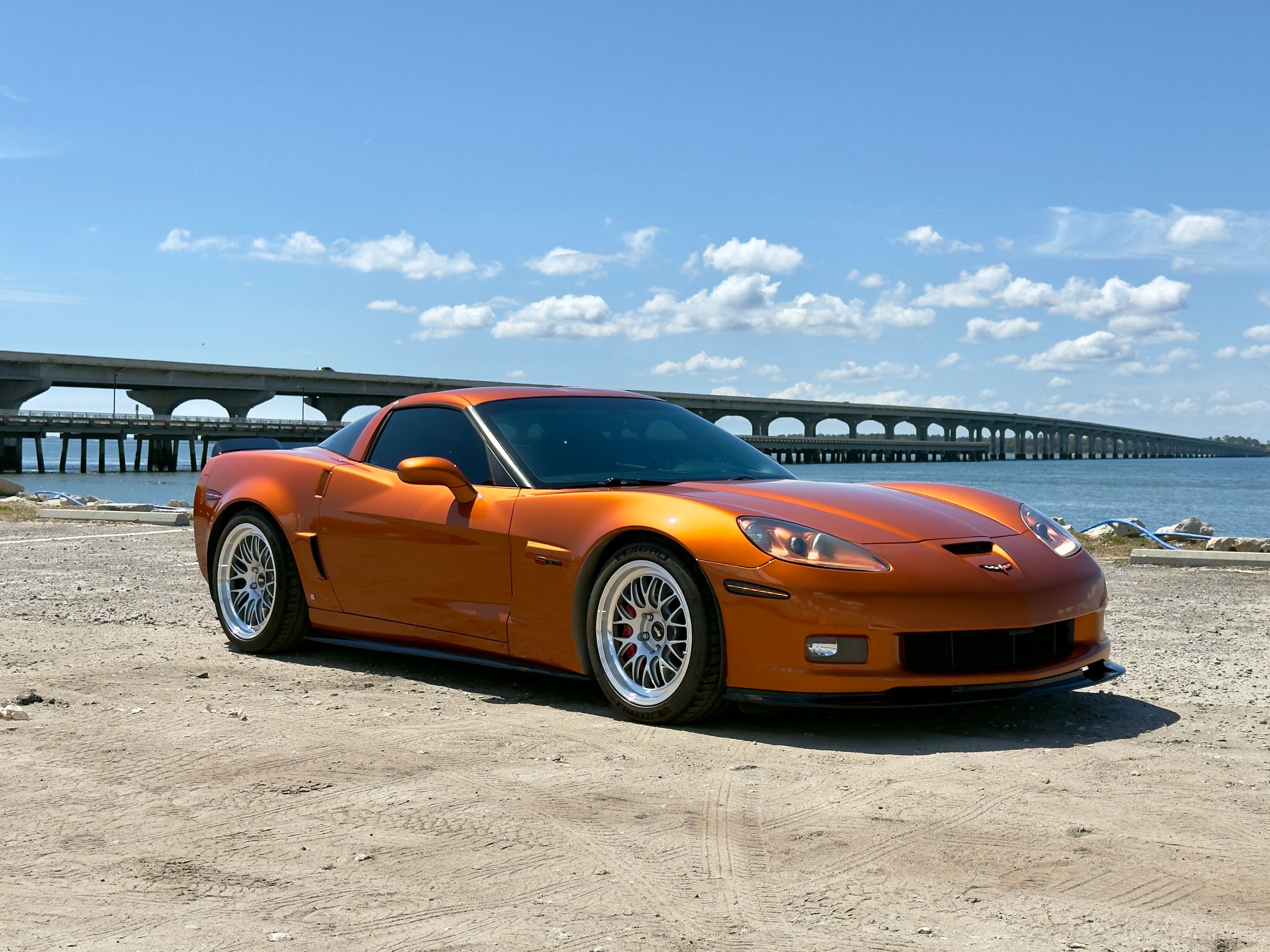 Orange Chevrolet C6 Corvette Z06 with 18"/19" ML-10RT Apex wheels in Machined Lip Race Silver