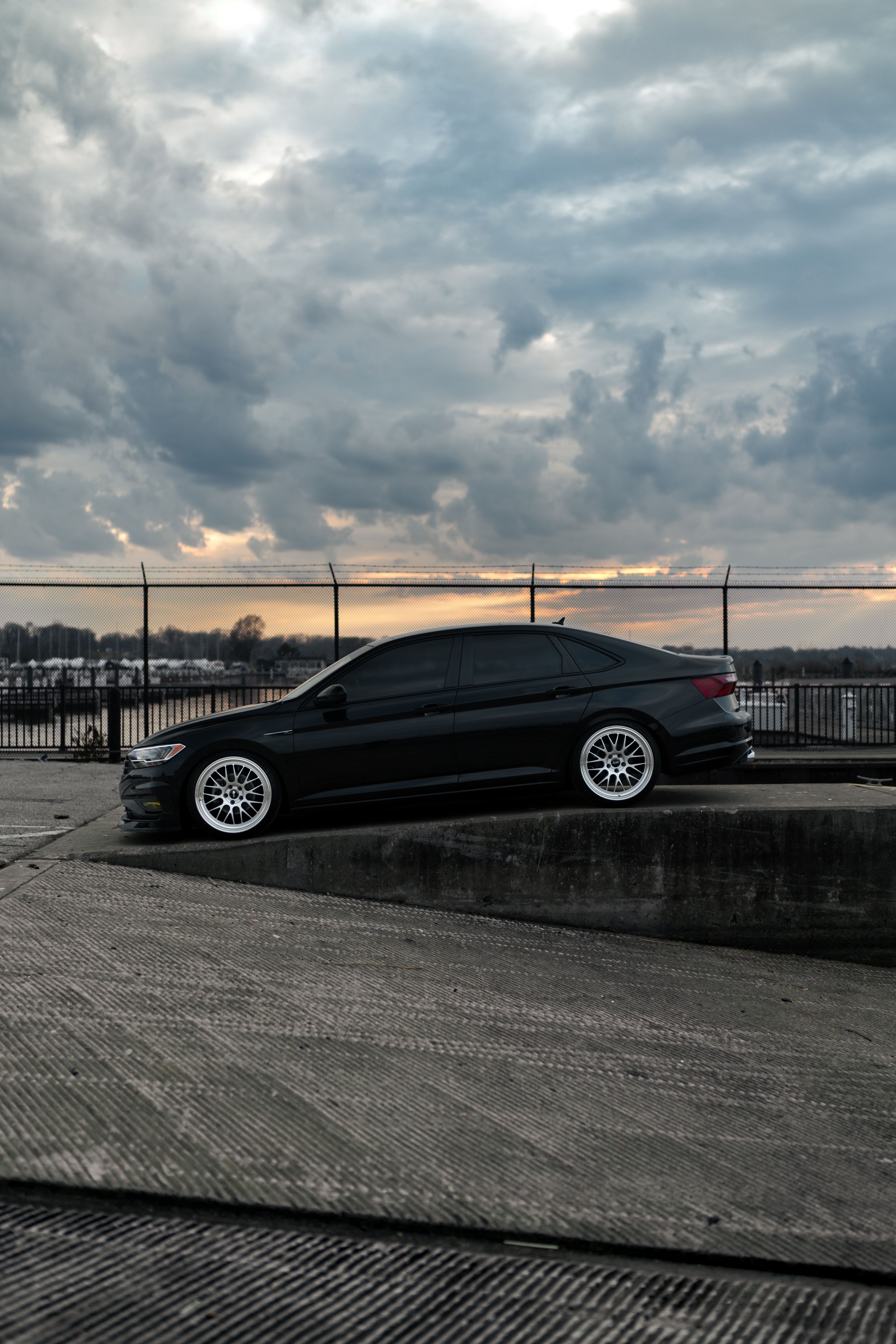 Black VW MK7 Jetta with 19" ML-10RT Apex wheels in Machined Lip Race Silver