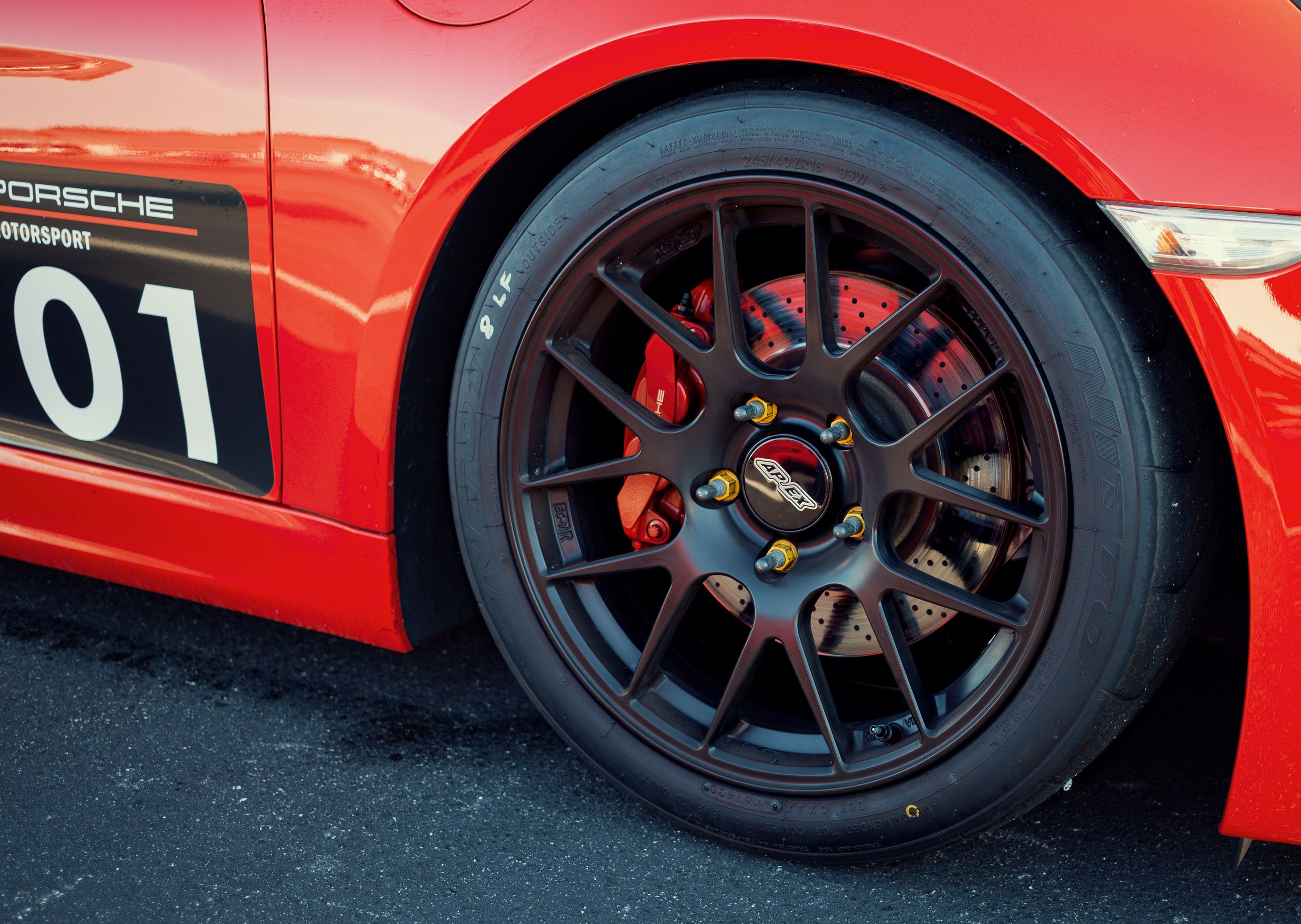 Red Porsche 981 Cayman S with 18" EC-7R Apex wheels in Satin Black