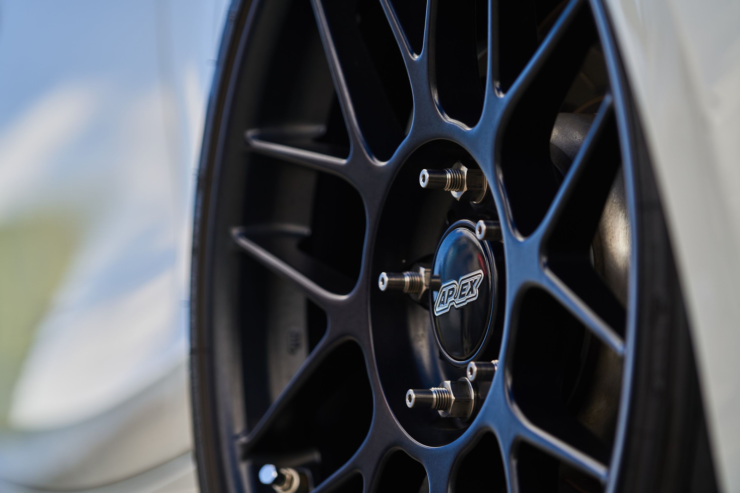 White BMW E82 Coupe 1 Series with 18" ARC-8 Apex wheels in Satin Black