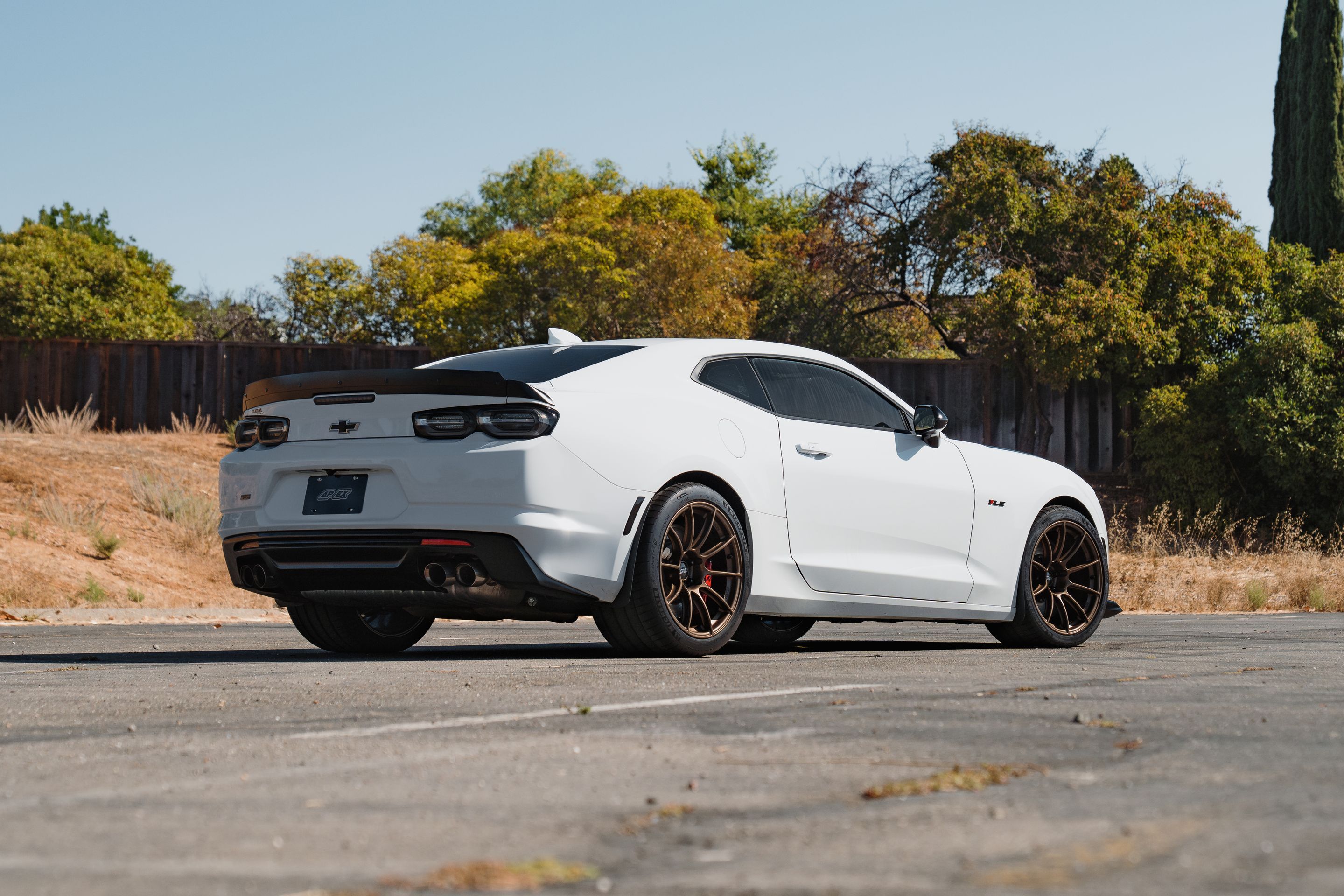 White Chevrolet 6th Gen Camaro SS 1LE with 19" SM-10RS Apex wheels in Satin Bronze