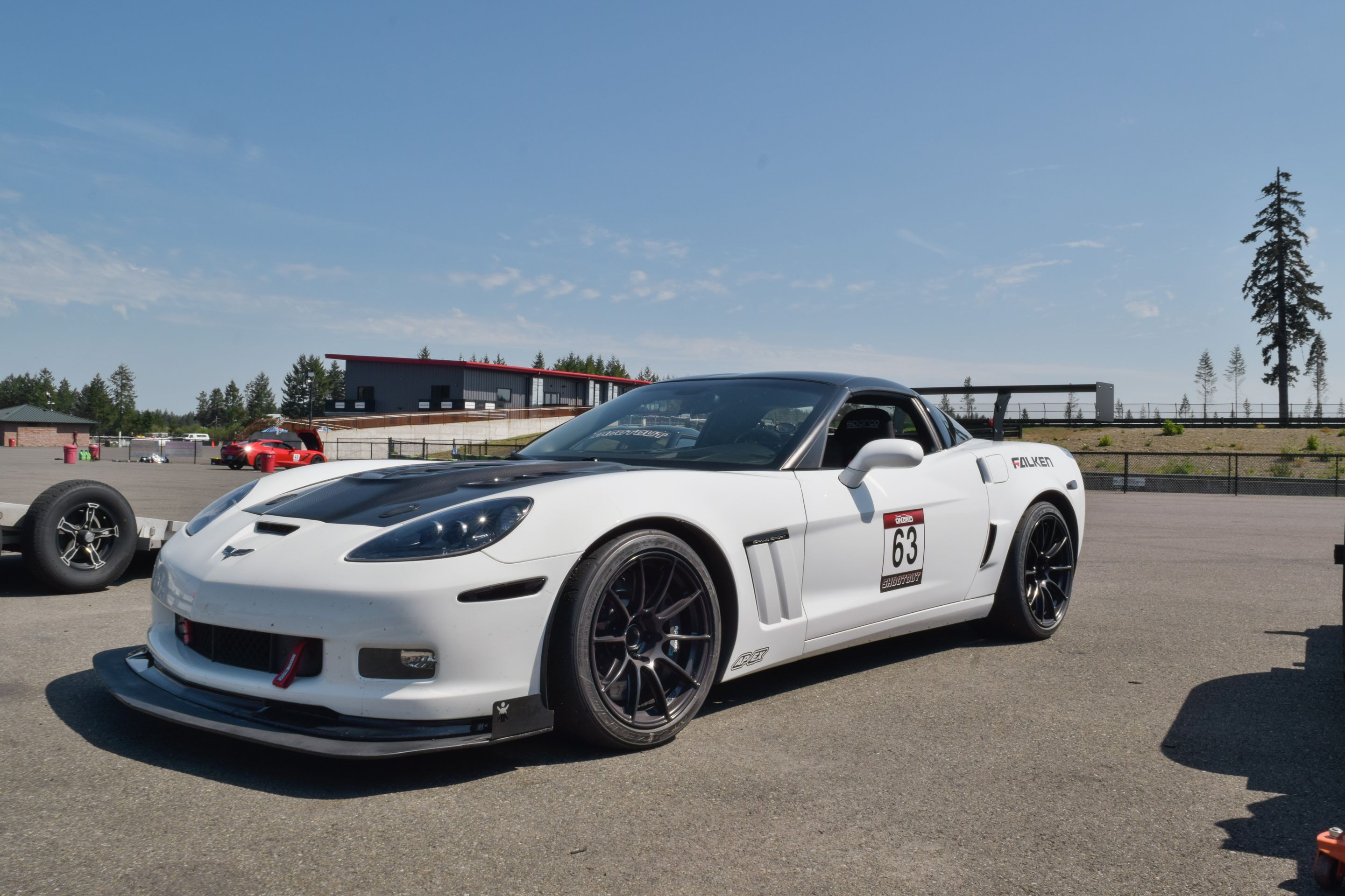 White Chevrolet C6 Corvette Grand Sport with 18"/19" SM-10RS Apex wheels in Satin Black