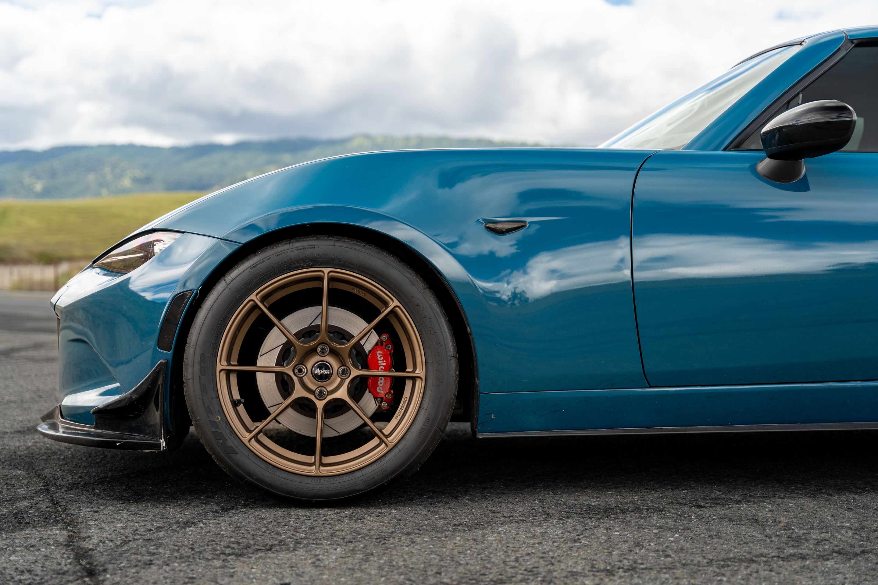 Blue Mazda ND MX-5 Miata with 17" SM-8RS Apex wheels in Satin Bronze