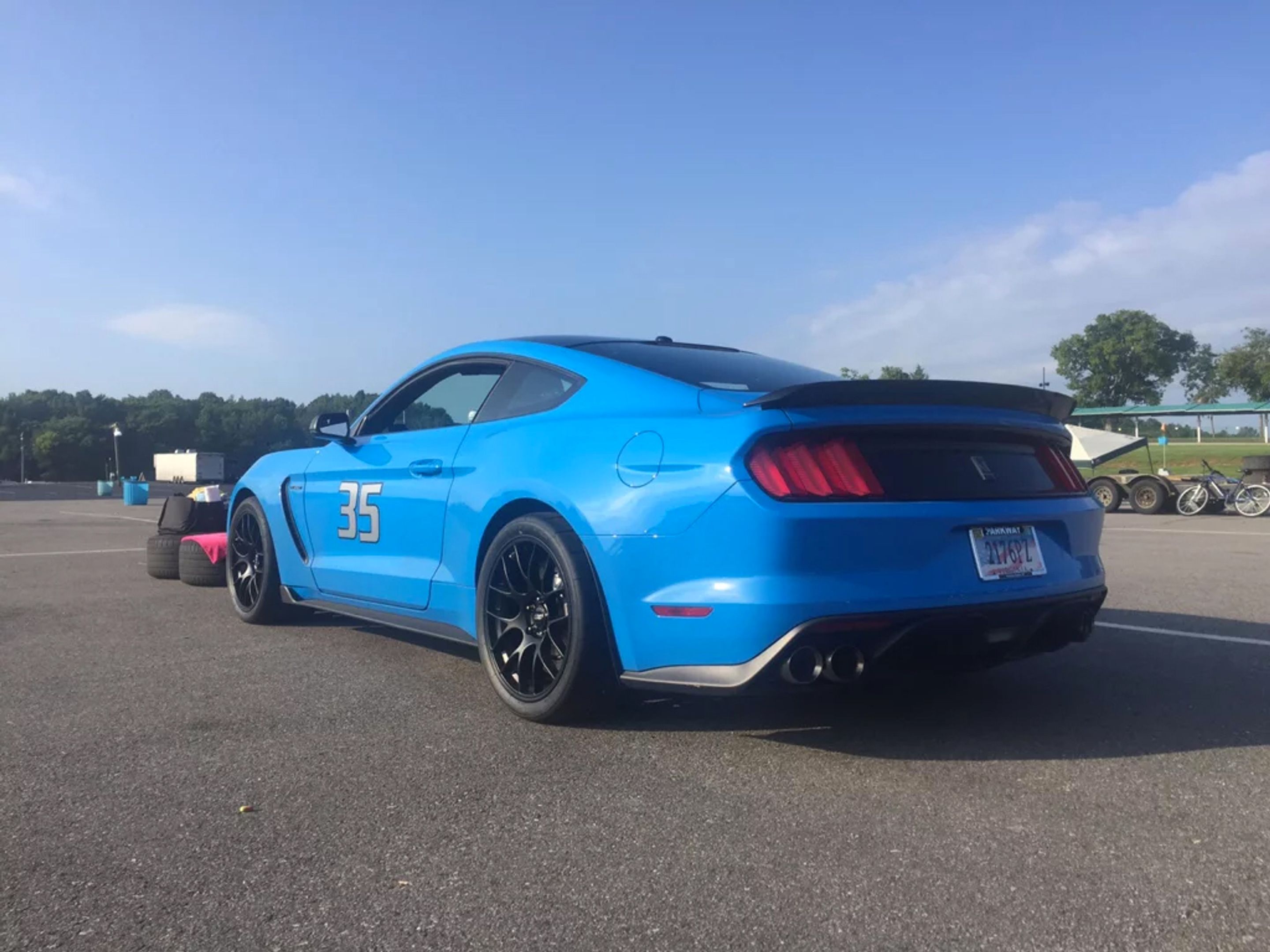 Blue Ford S550 Mustang GT350 with 19" EC-7 Apex wheels in Satin Black