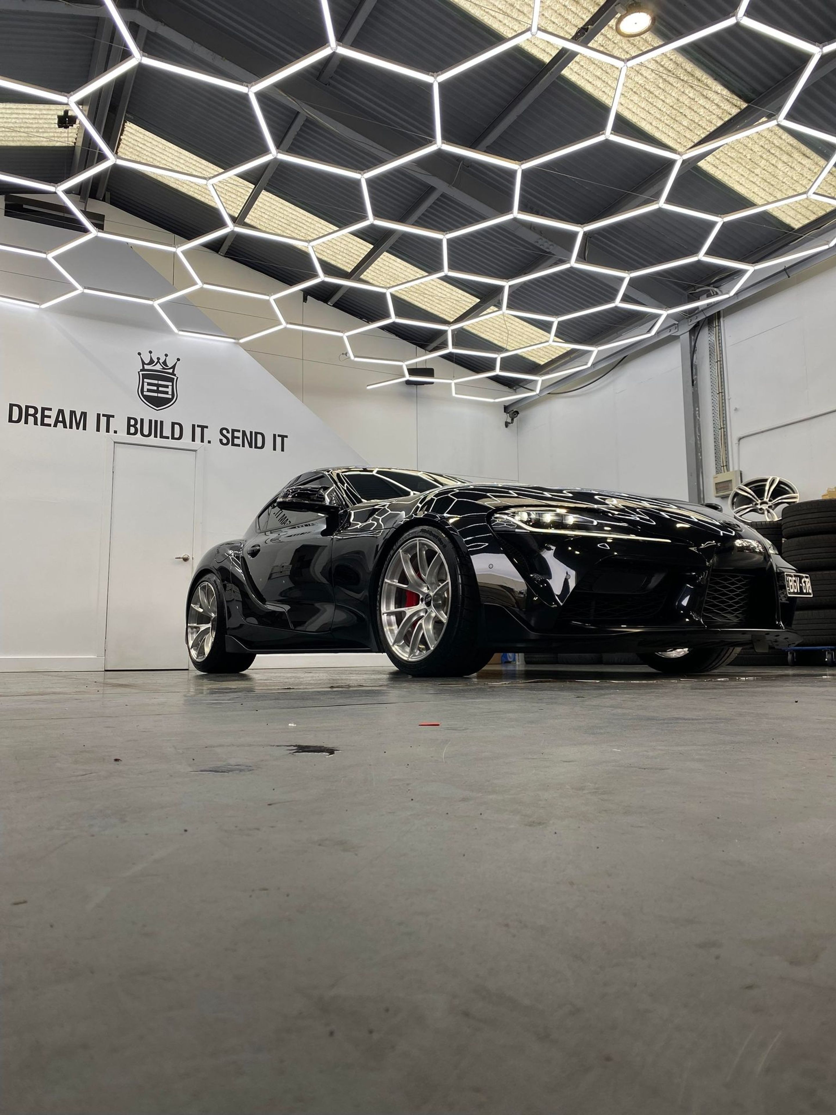 Black Toyota GR Supra with 19" VS-5RS Apex wheels in Brushed Clear