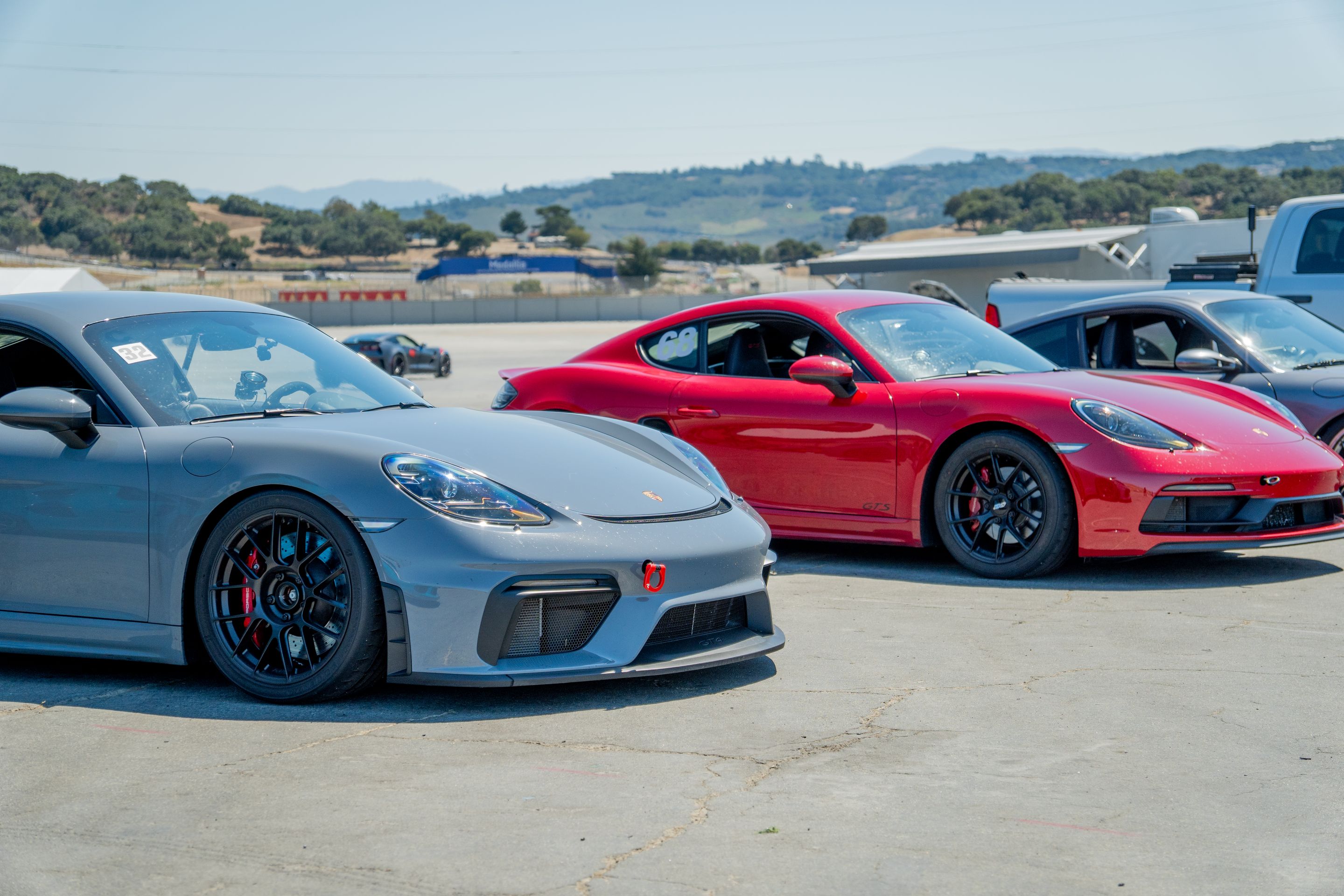 Grey Porsche 718 Cayman GT4 with 19" EC-7RS Apex wheels in Satin Black