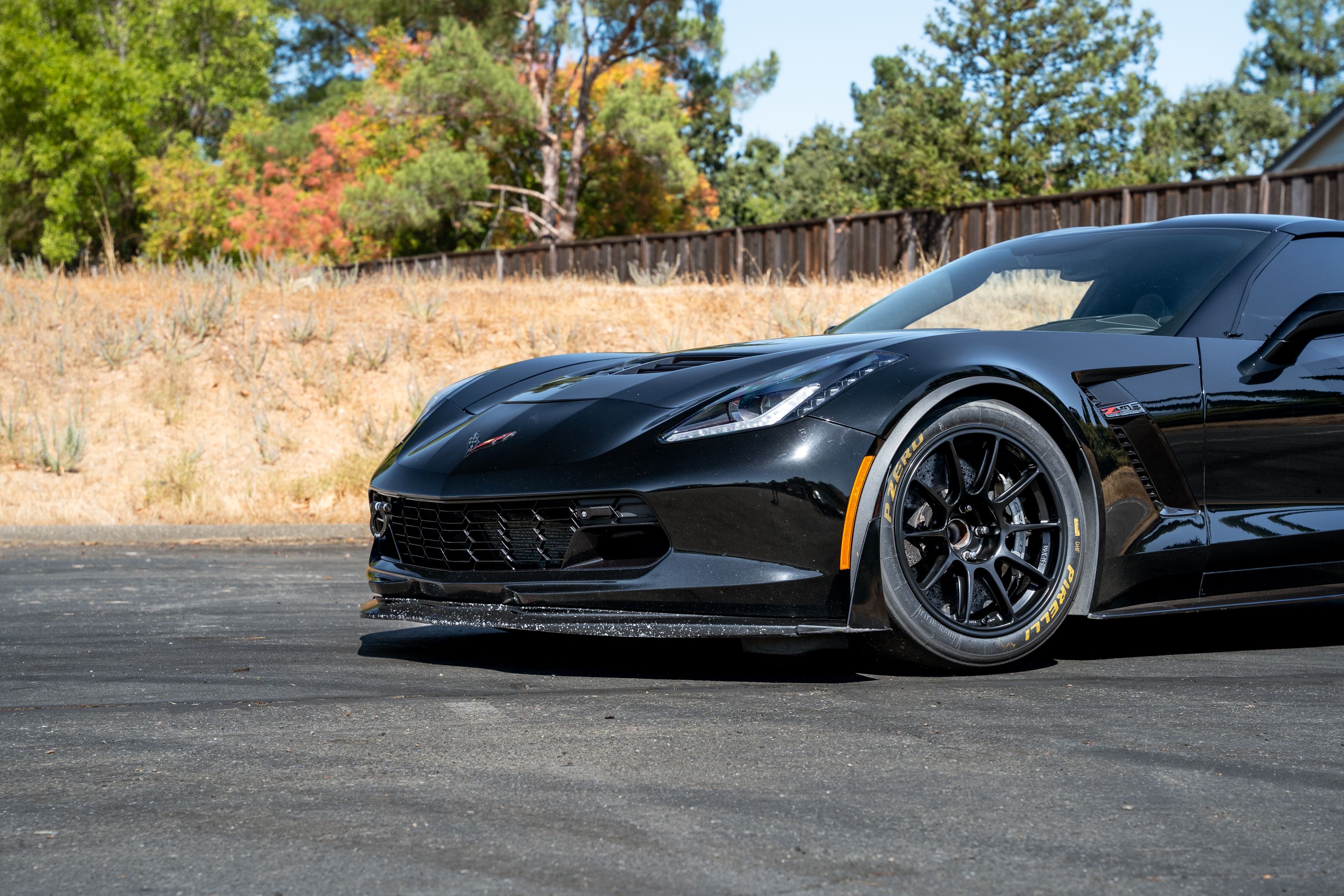 Black Chevrolet C7 Corvette Z06 with 18" SM-10RE Apex wheels in Satin Black