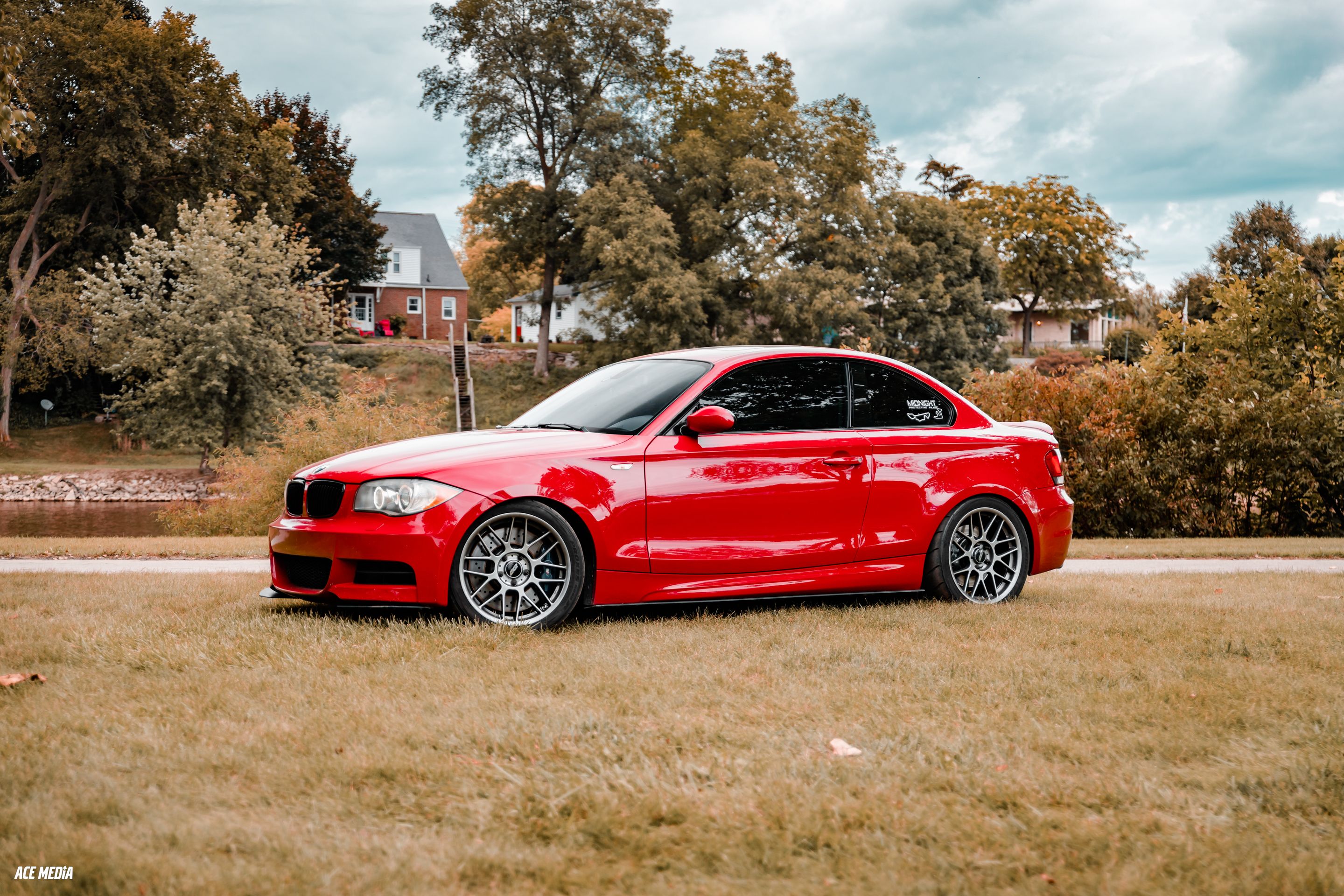 Red BMW E82 Coupe 1 Series with 18" ARC-8 Apex wheels in Hyper Black