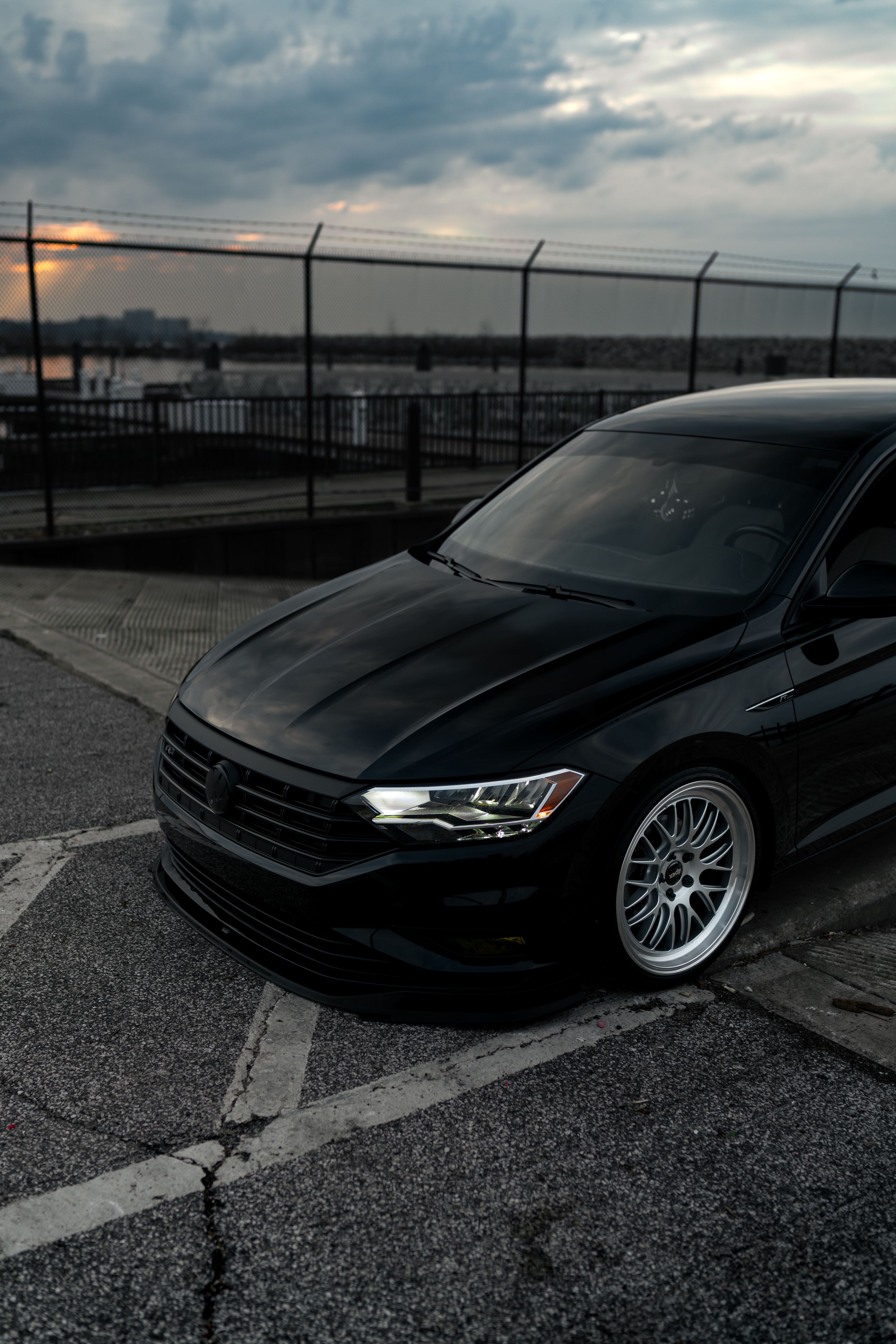 Black VW MK7 Jetta with 19" ML-10RT Apex wheels in Machined Lip Race Silver