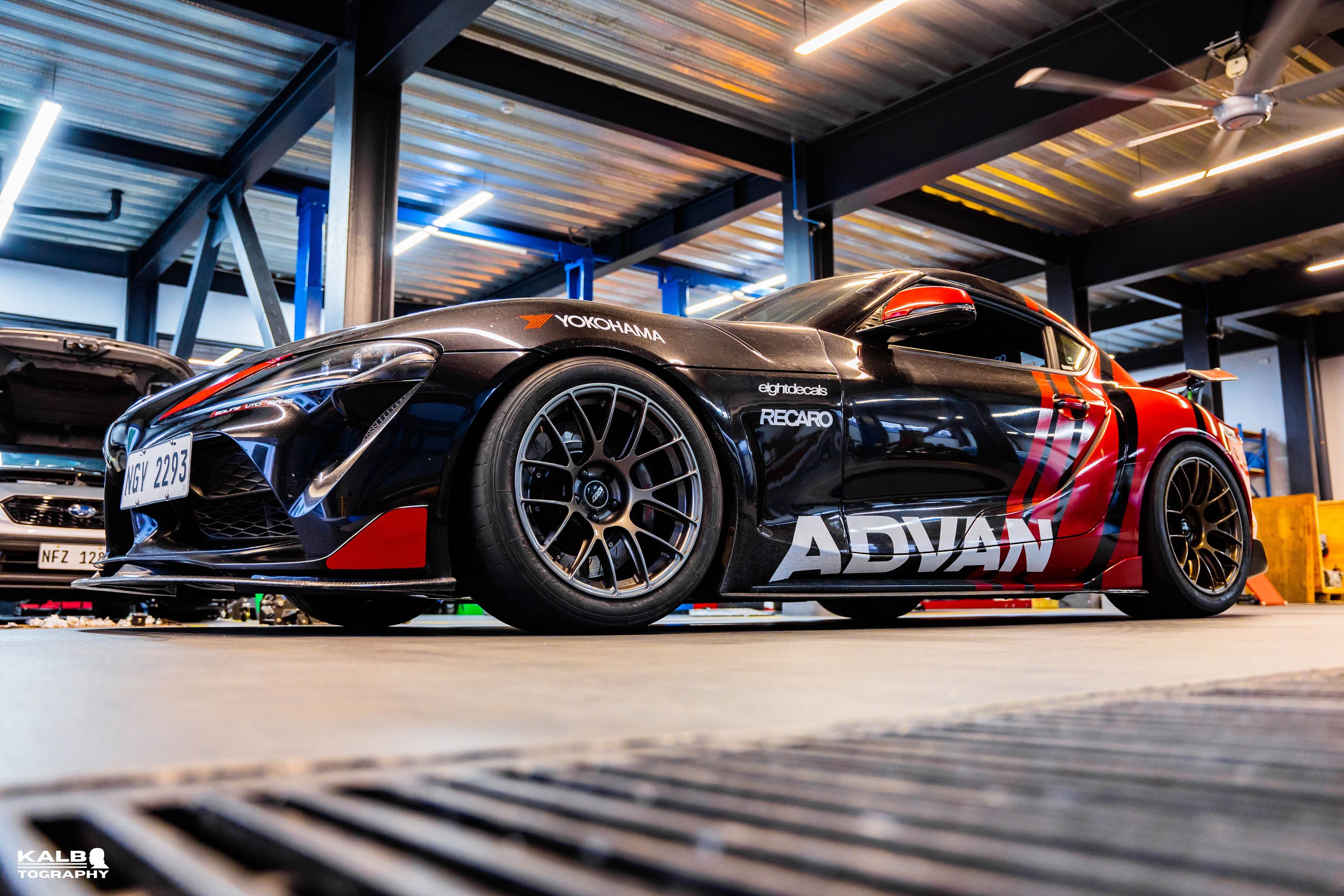 Black Toyota GR Supra with 18" EC-7RS Apex wheels in Satin Bronze