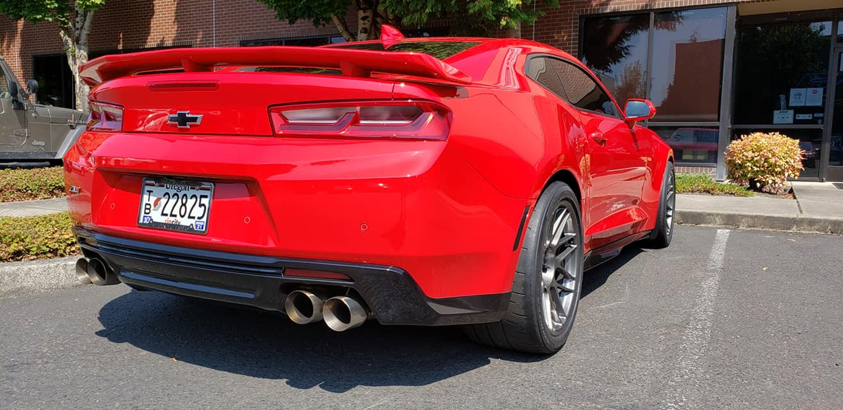 Red Chevrolet 6th Gen Camaro ZL1 with 19" ARC-8 Apex wheels in Anthracite