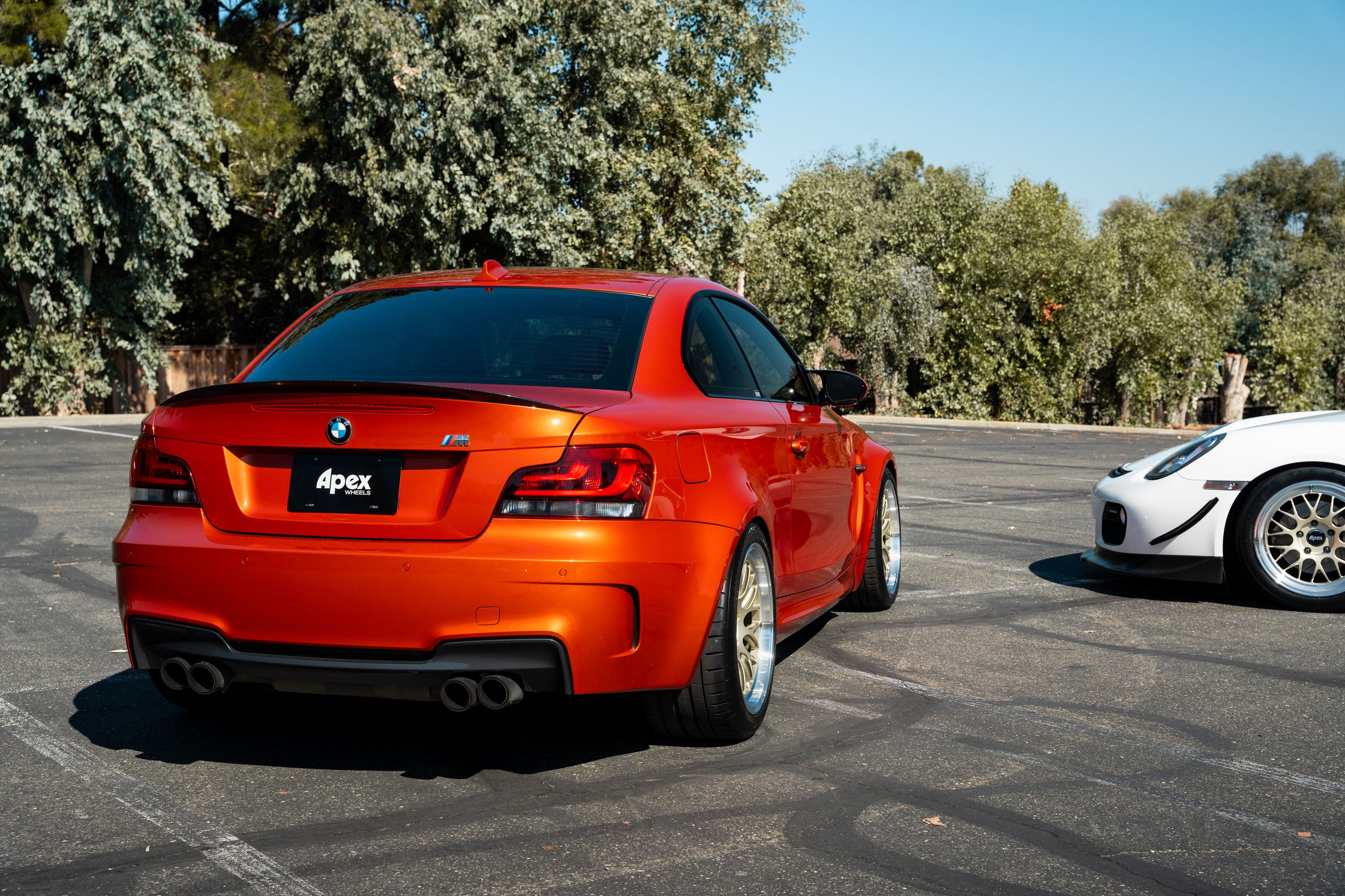 Orange BMW E82 1M with 18" ML-10RT Apex wheels in Machined Lip Gloss Motorsport Gold