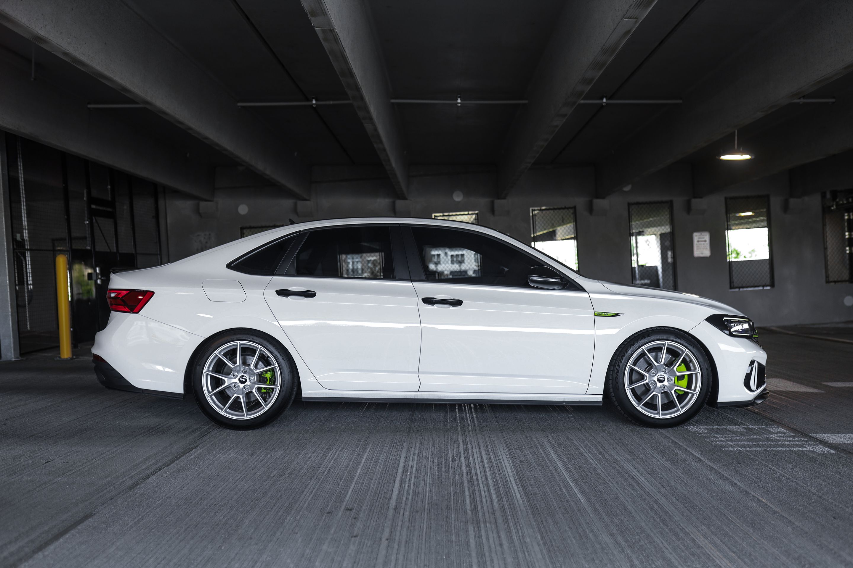 White VW MK7 GLI with 18" VS-5 Apex wheels in Race Silver