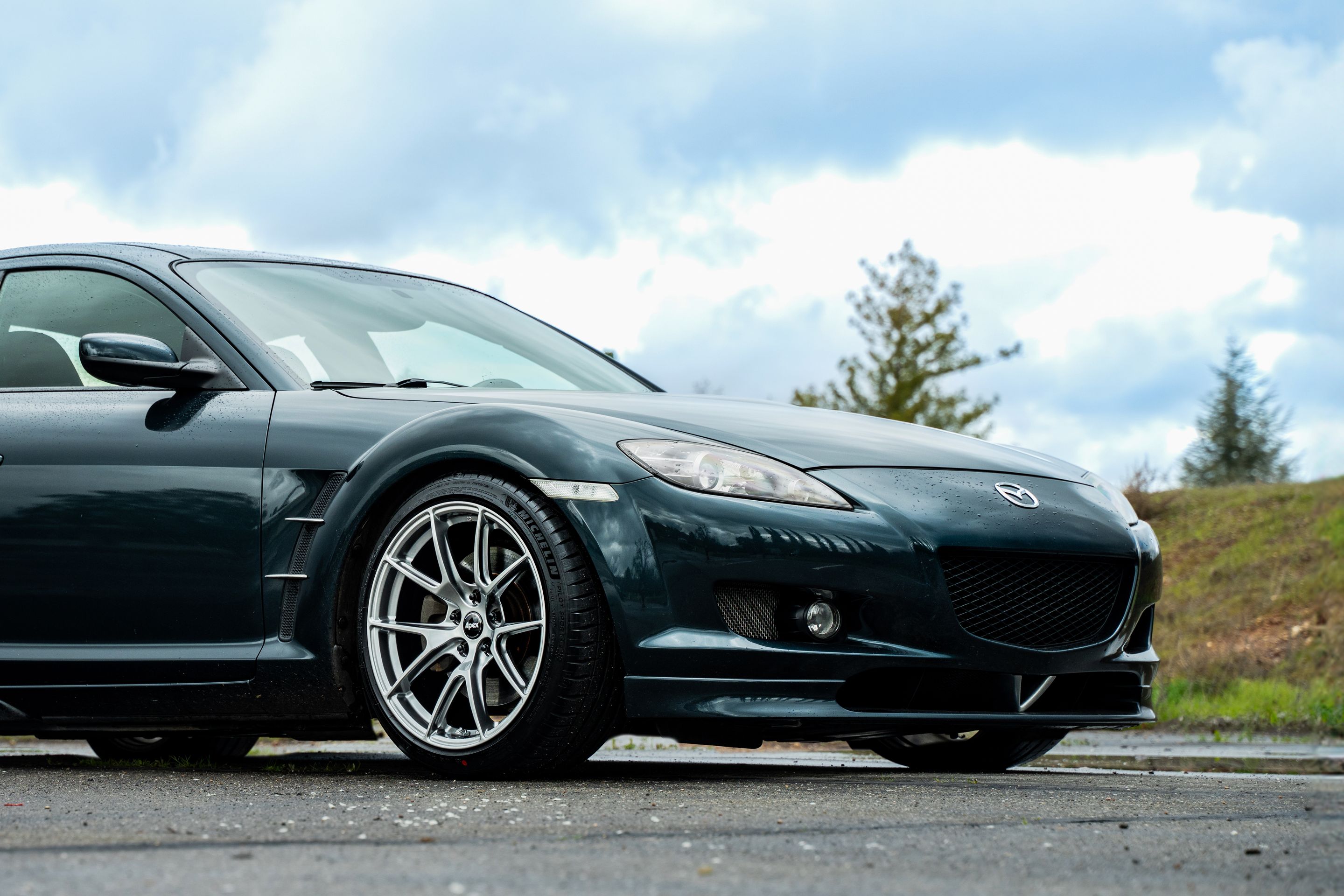 Green Mazda RX-8 with 18" VS-5 Apex wheels in Hyper Black