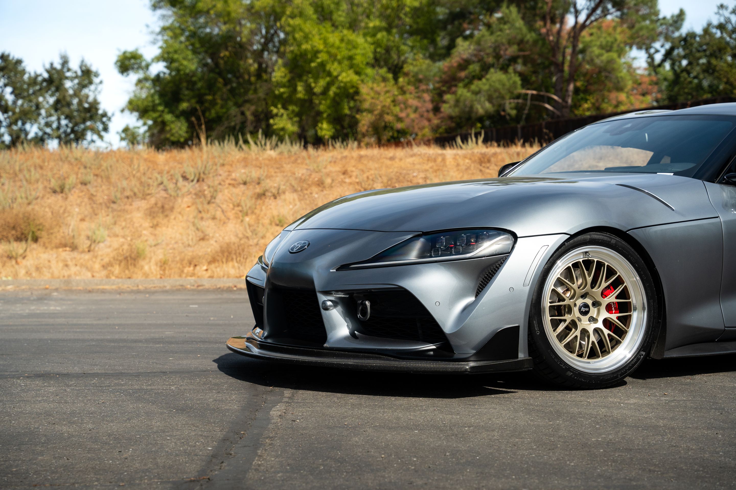 Grey Toyota GR Supra with 19" ML-10RT Apex wheels in Machined Lip Gloss Motorsport Gold