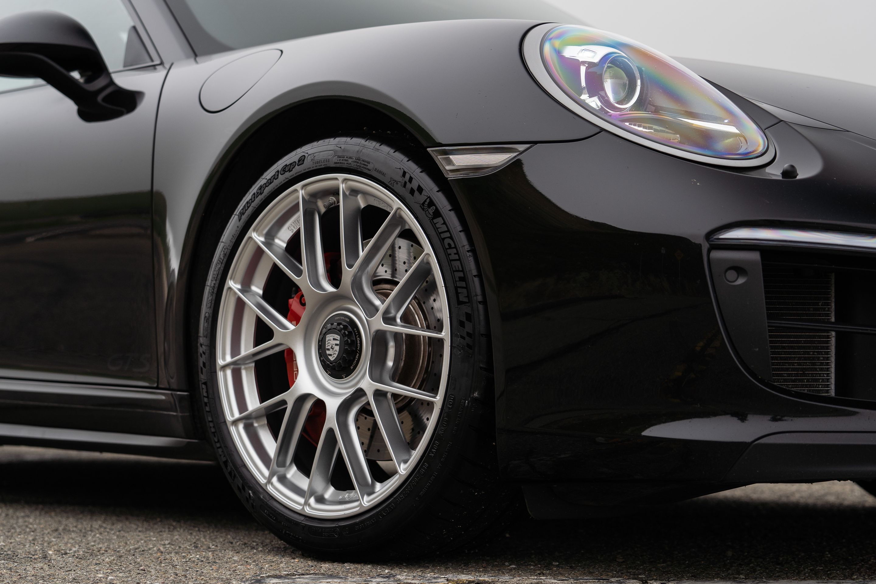 Black Porsche 911 991.2 Carrera GTS with 19" EC-7RS Apex wheels in Race Silver