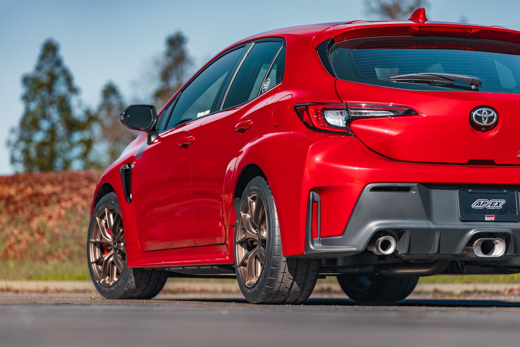 Red Toyota GR Corolla with 17" VS-5RS Apex wheels in Satin Bronze