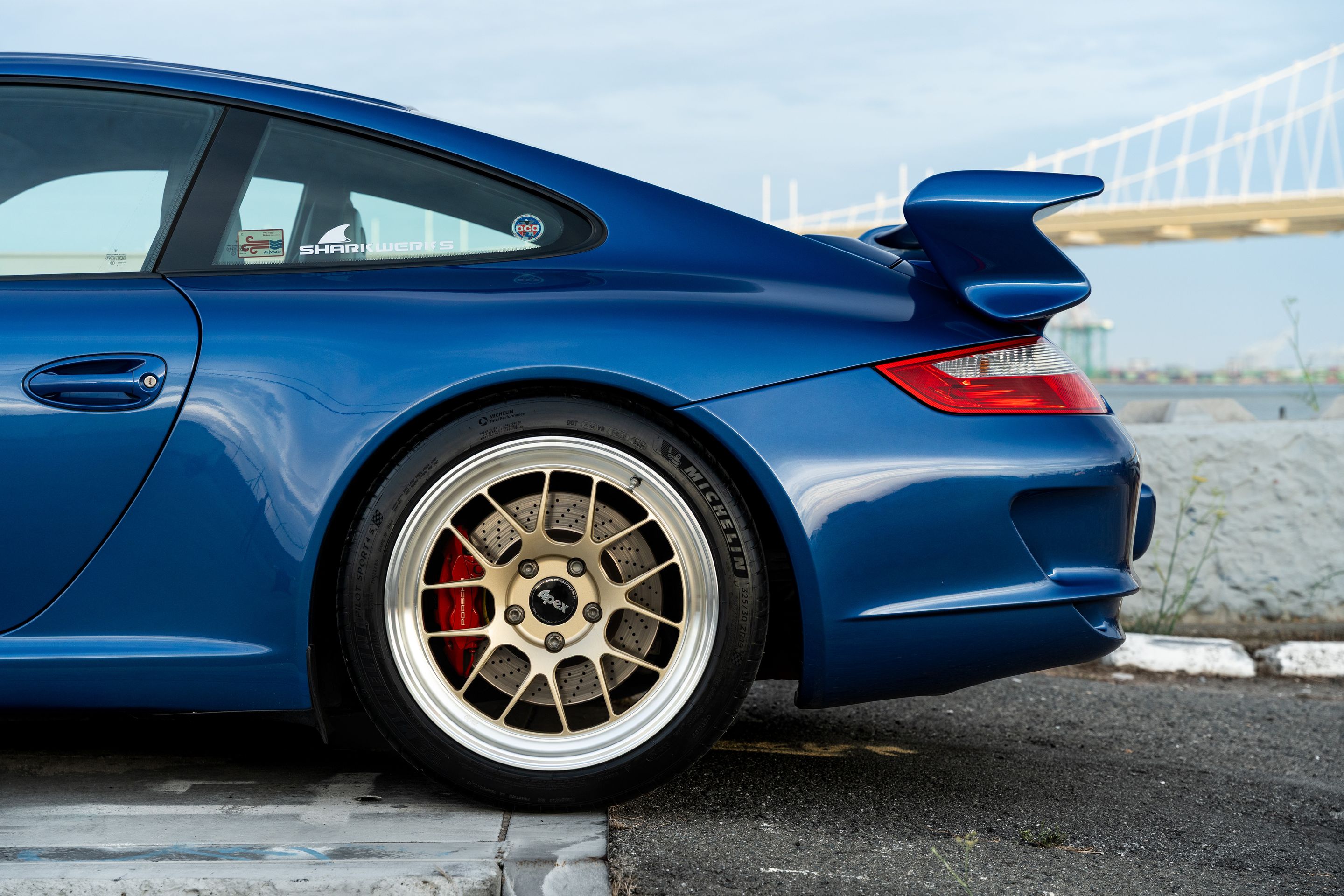 Blue Porsche 911 997 GT3 with 19" TEST-M Apex wheels in Machined Lip Gloss Motorsport Gold