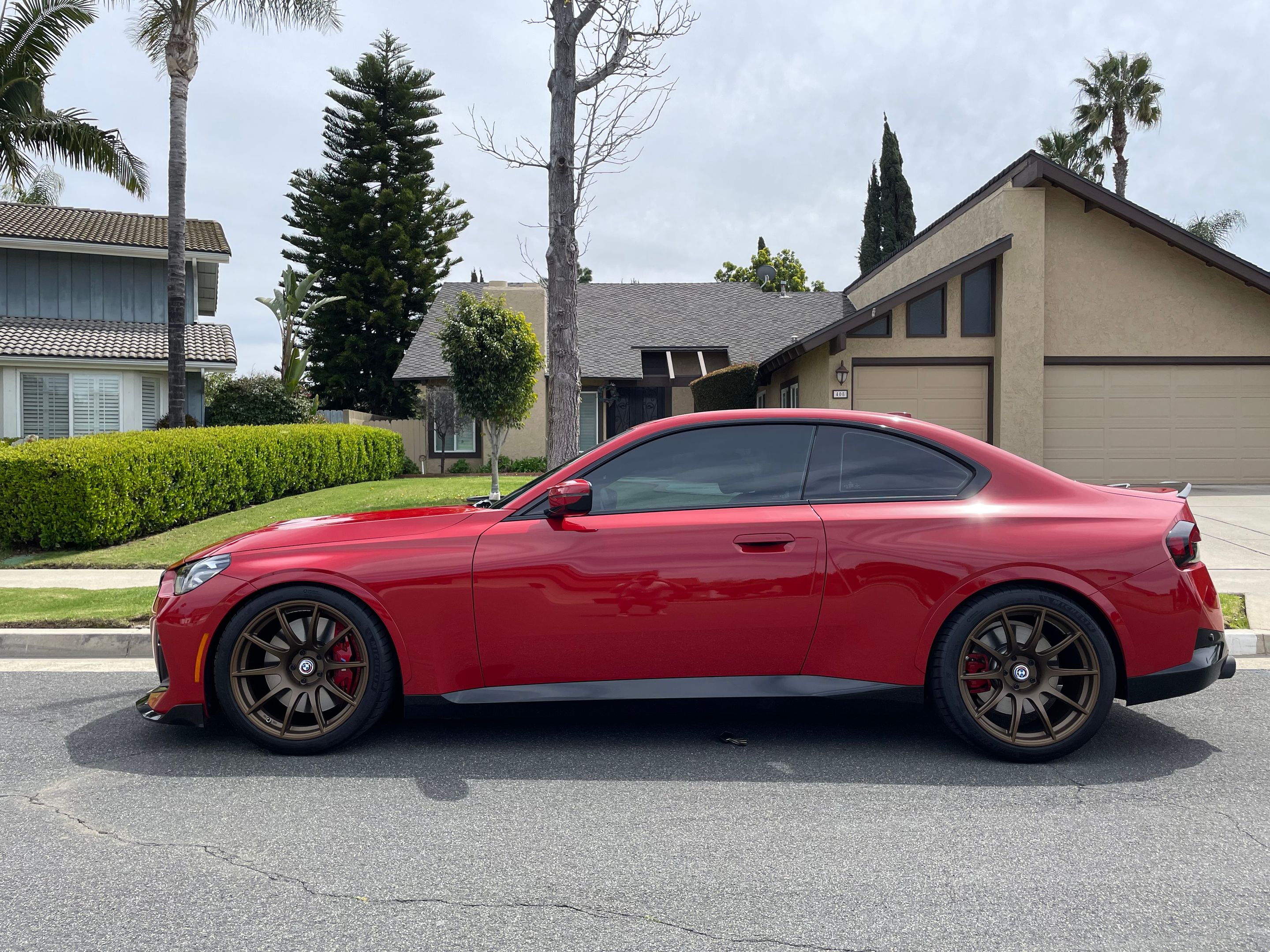 Red BMW G42 2 Series with 19" SM-10 Apex wheels in Satin Bronze