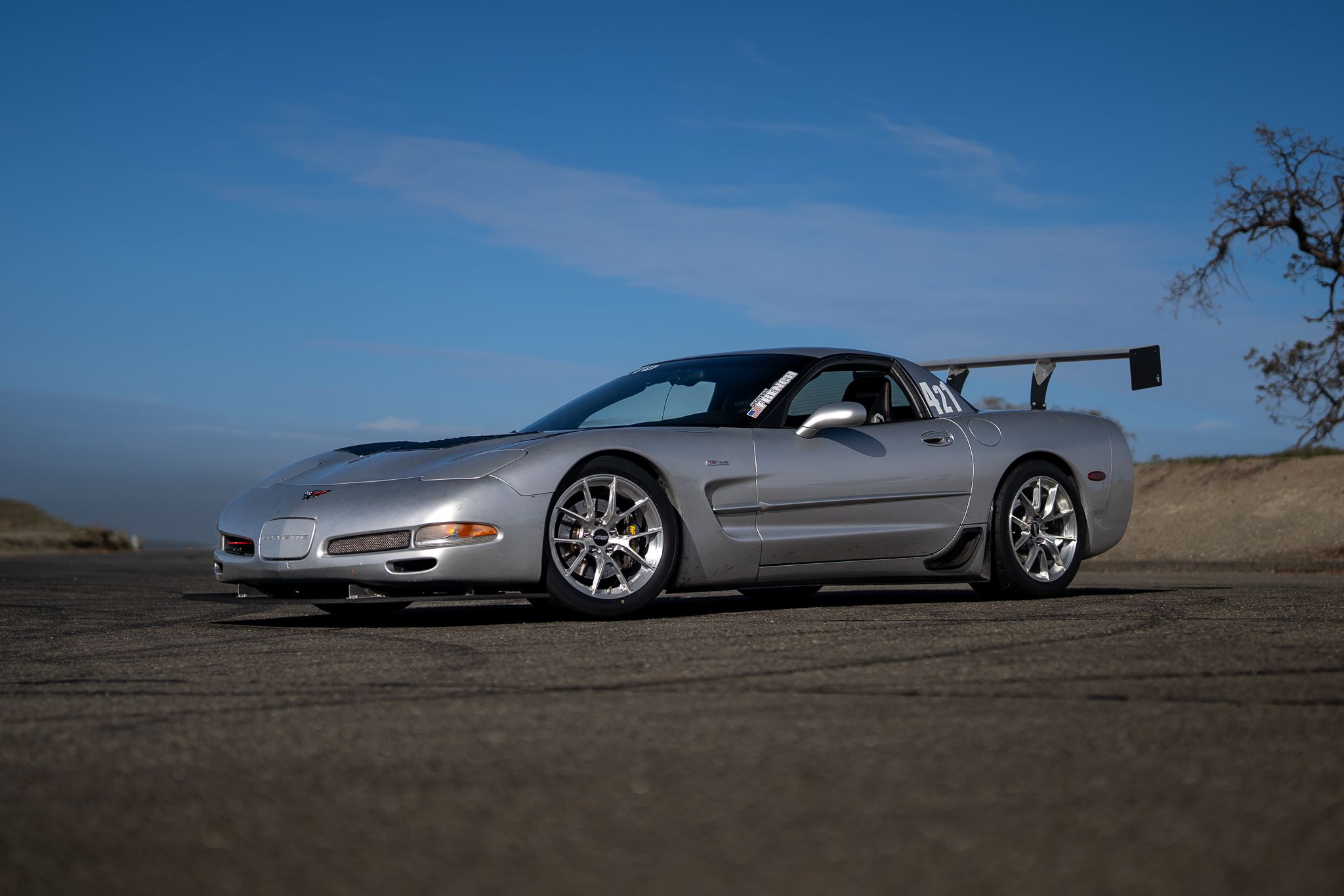 Silver Chevrolet C5 Corvette Z06 with 18" VS-5RS Apex wheels in Brushed Clear