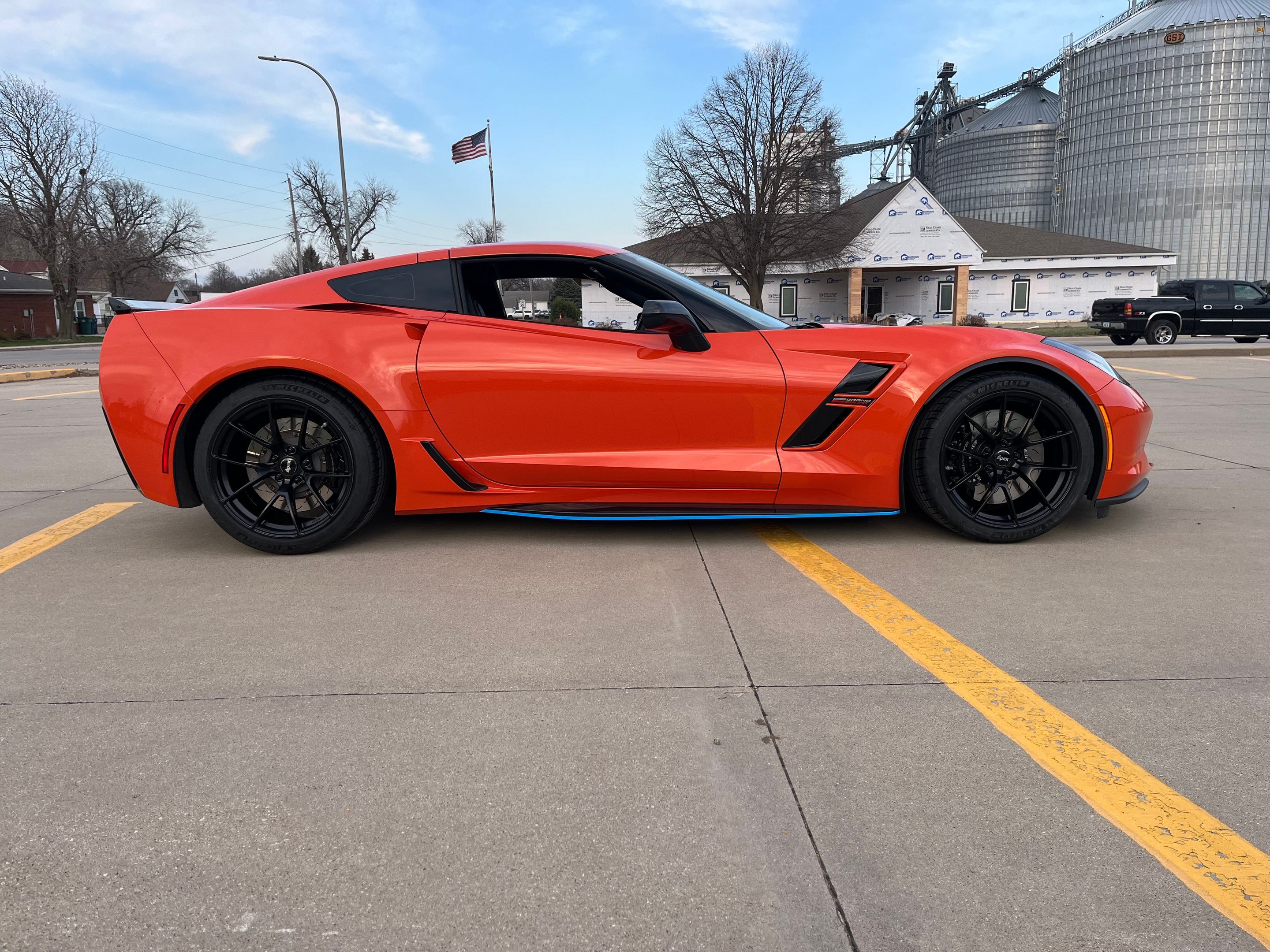 Orange Chevrolet C7 Corvette Grand Sport with 19" VS-5RS Apex wheels in Satin Black