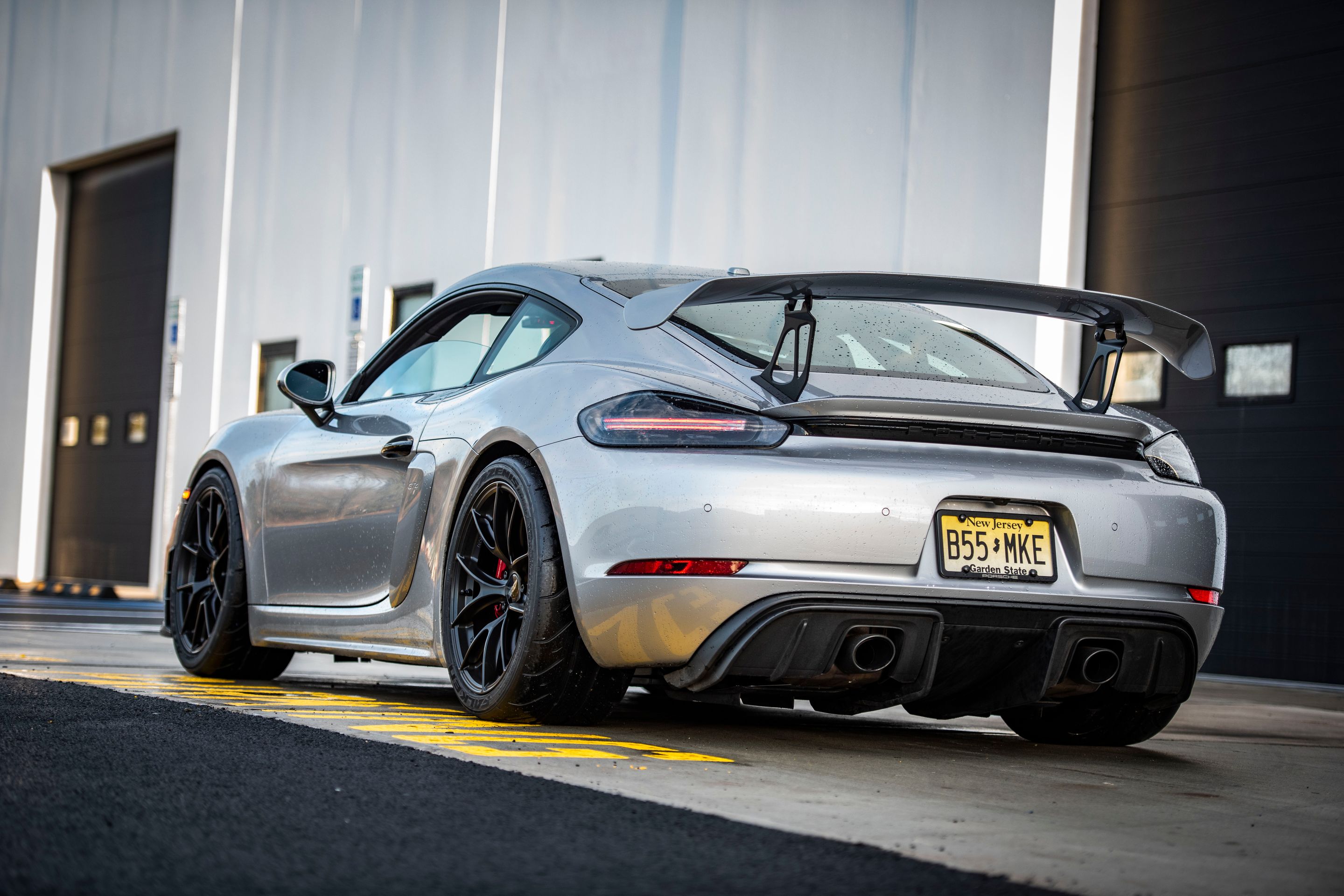 Silver Porsche 718 Cayman GT4 with 19" VS-5RS Apex wheels in Satin Black