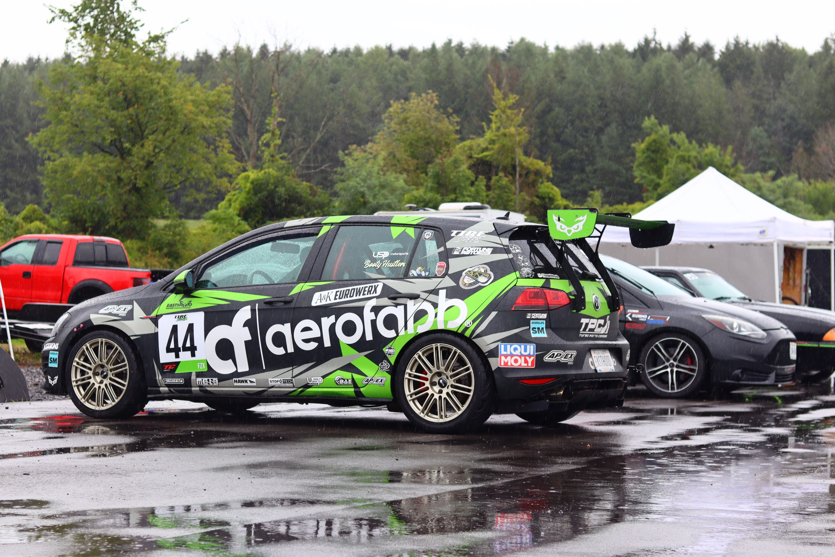 Race Livery VW MK7 GTI with 18" TC-10RT Apex wheels in Motorsport Gold