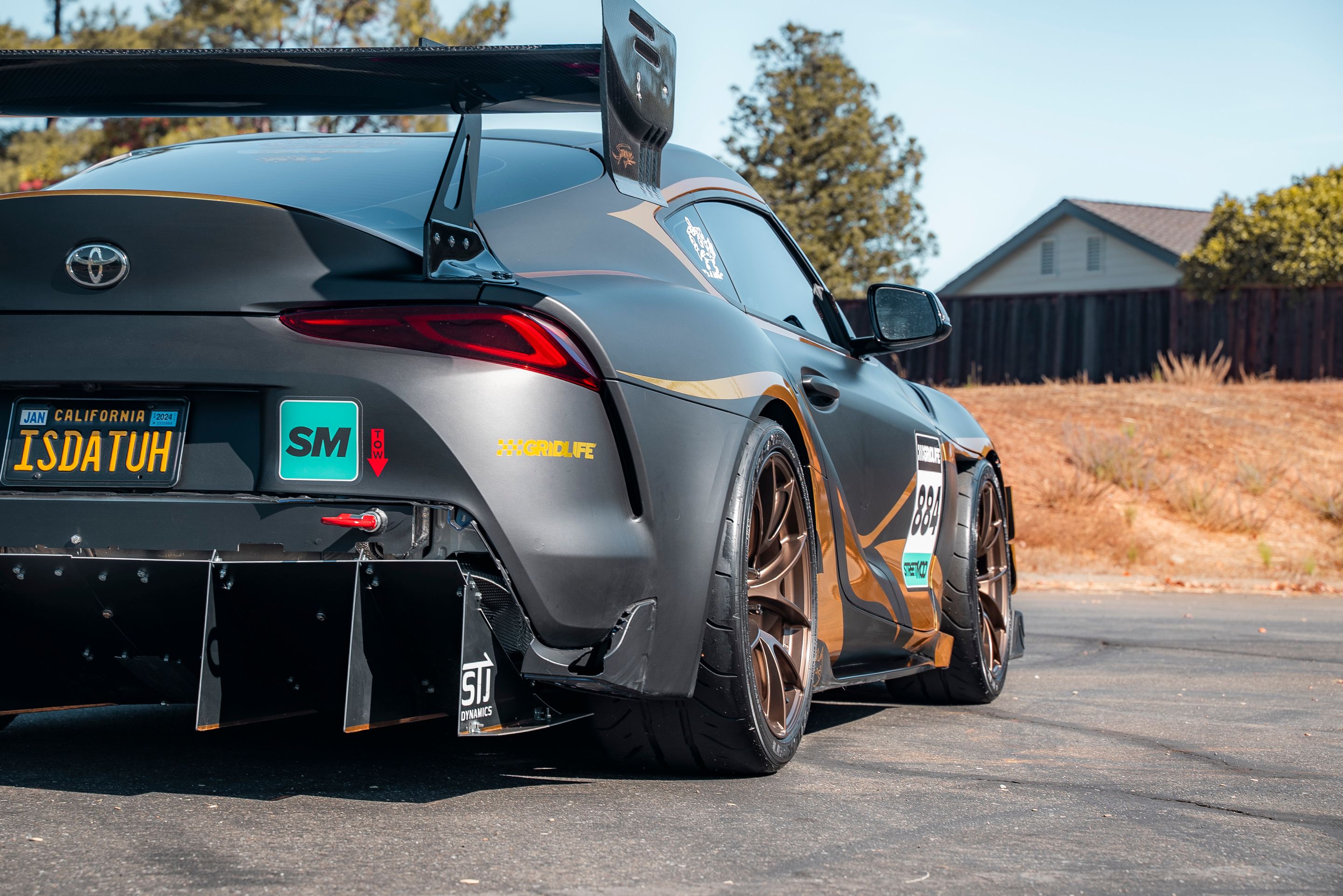 Grey Toyota GR Supra with 19" VS-5RS Apex wheels in Satin Bronze