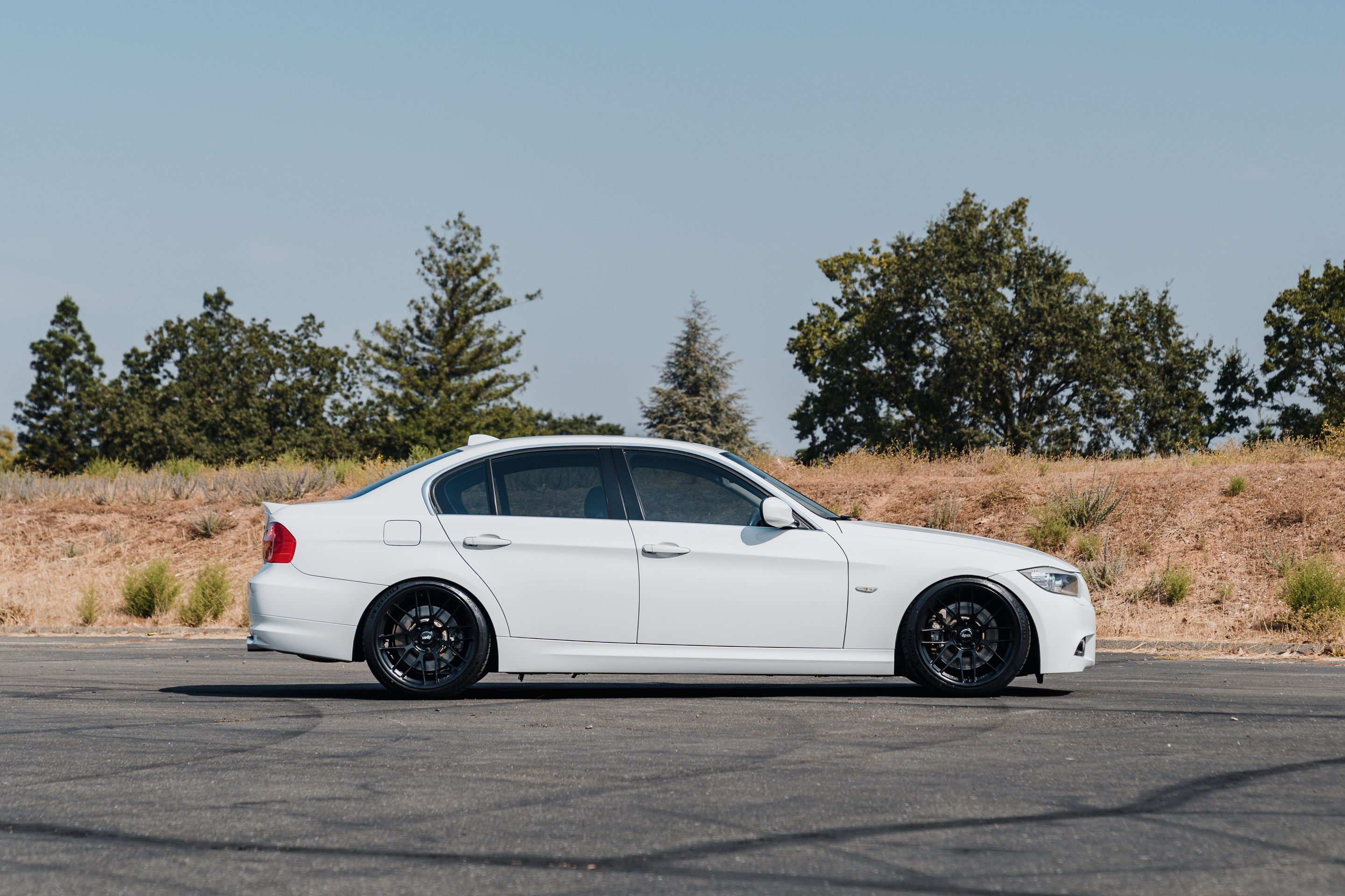 White BMW E90 LCI Sedan 3 Series with 19" ARC-8RT Apex wheels in Satin Black