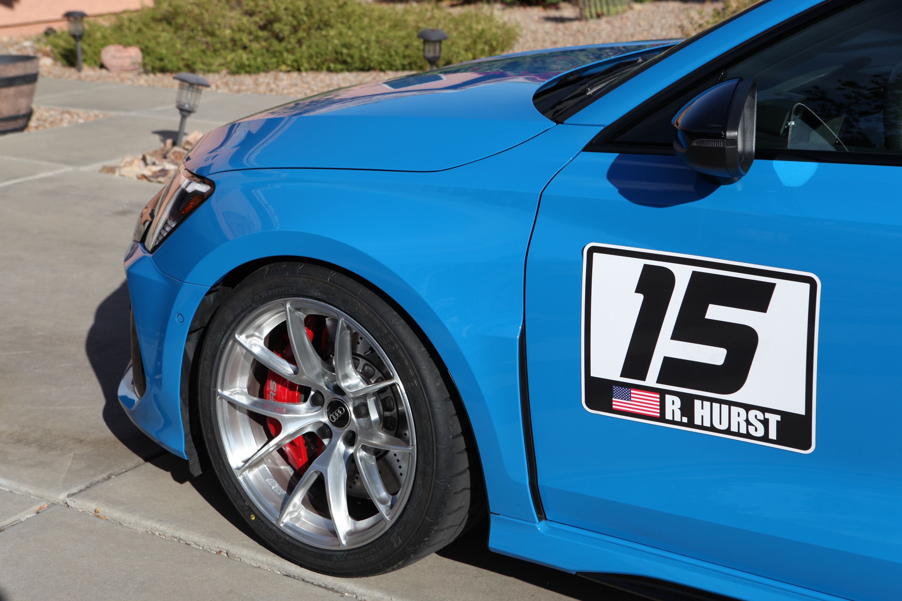 Blue Audi 8Y RS 3 with 18" VS-5RS Apex wheels in Brushed Clear