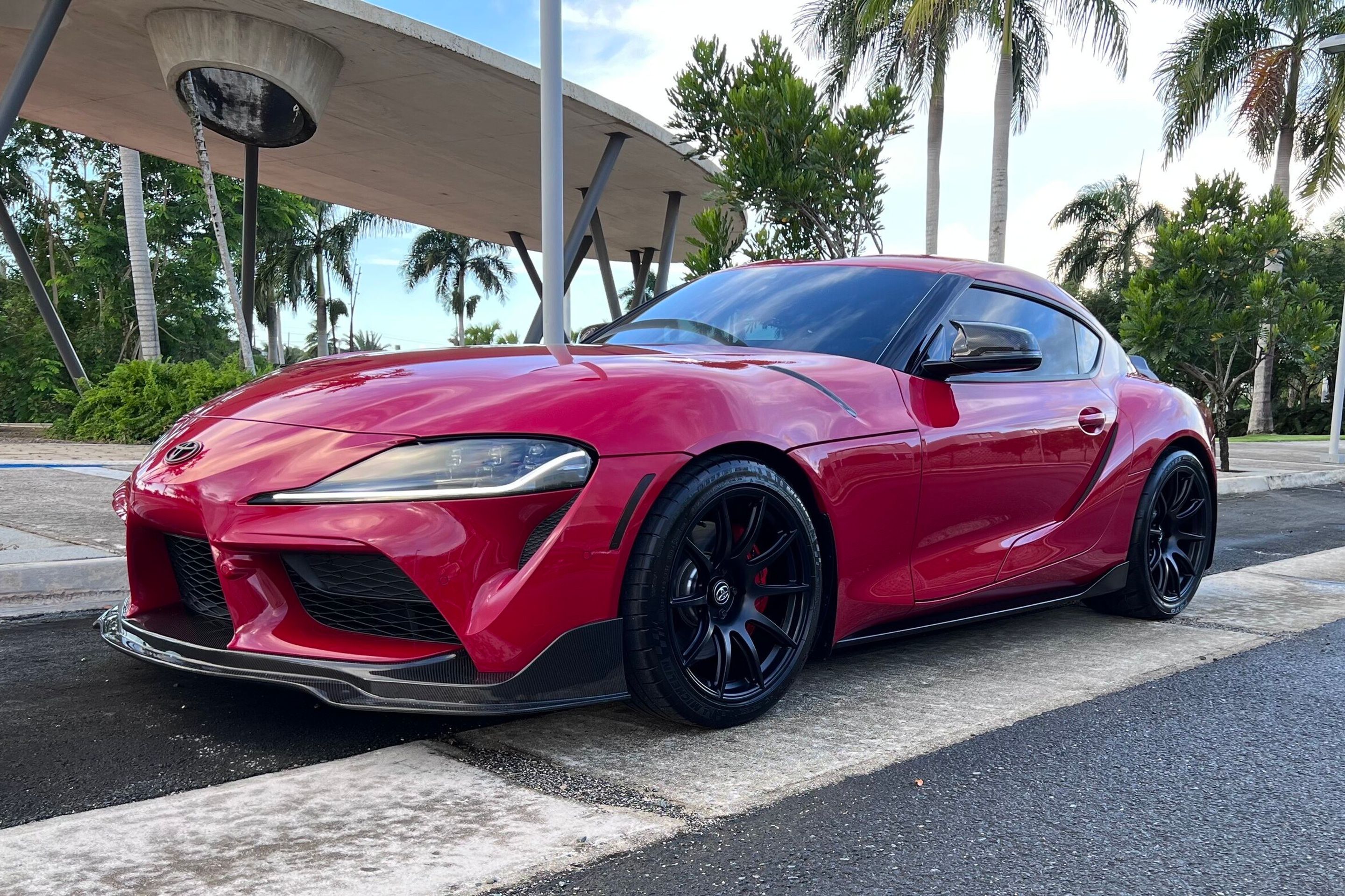 Red Toyota GR Supra with 19" SM-10 Apex wheels in Satin Black