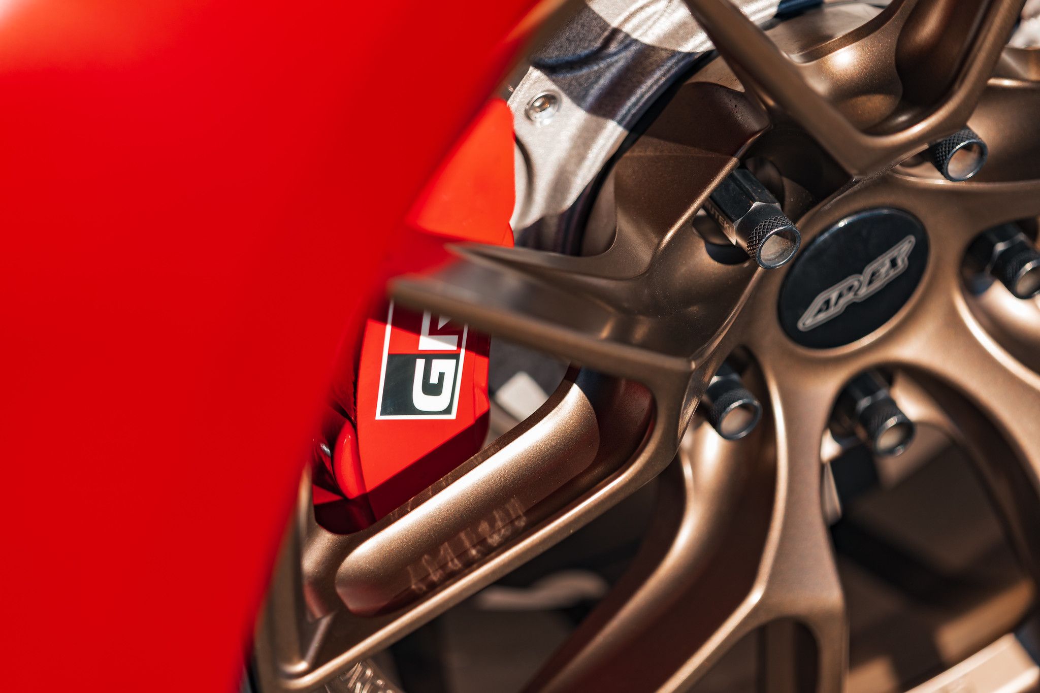 Red Toyota GR Corolla with 17" VS-5RS Apex wheels in Satin Bronze