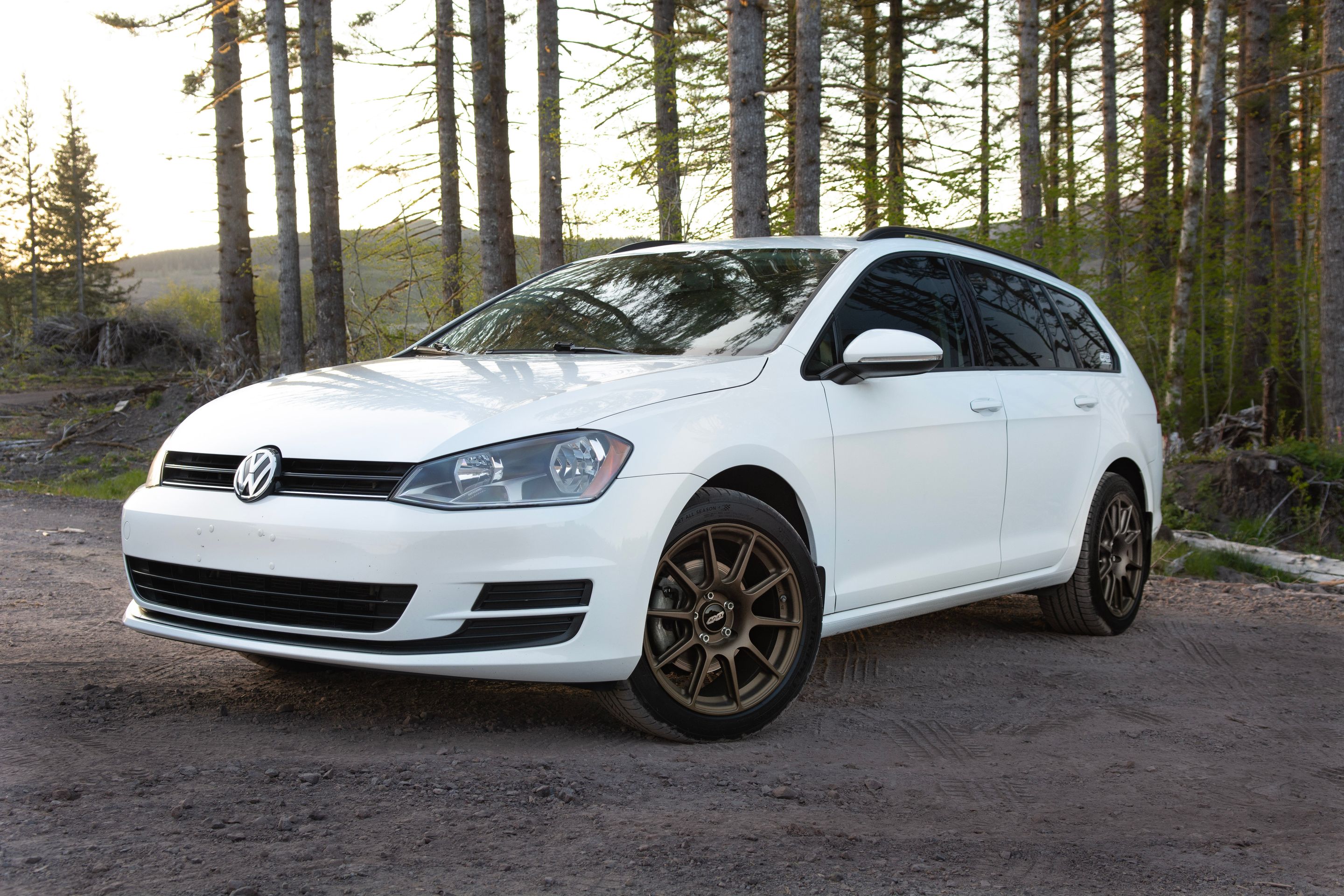 White VW MK7 Alltrack/SportWagen Golf SportWagen with 17" SM-10 Apex wheels in Satin Bronze