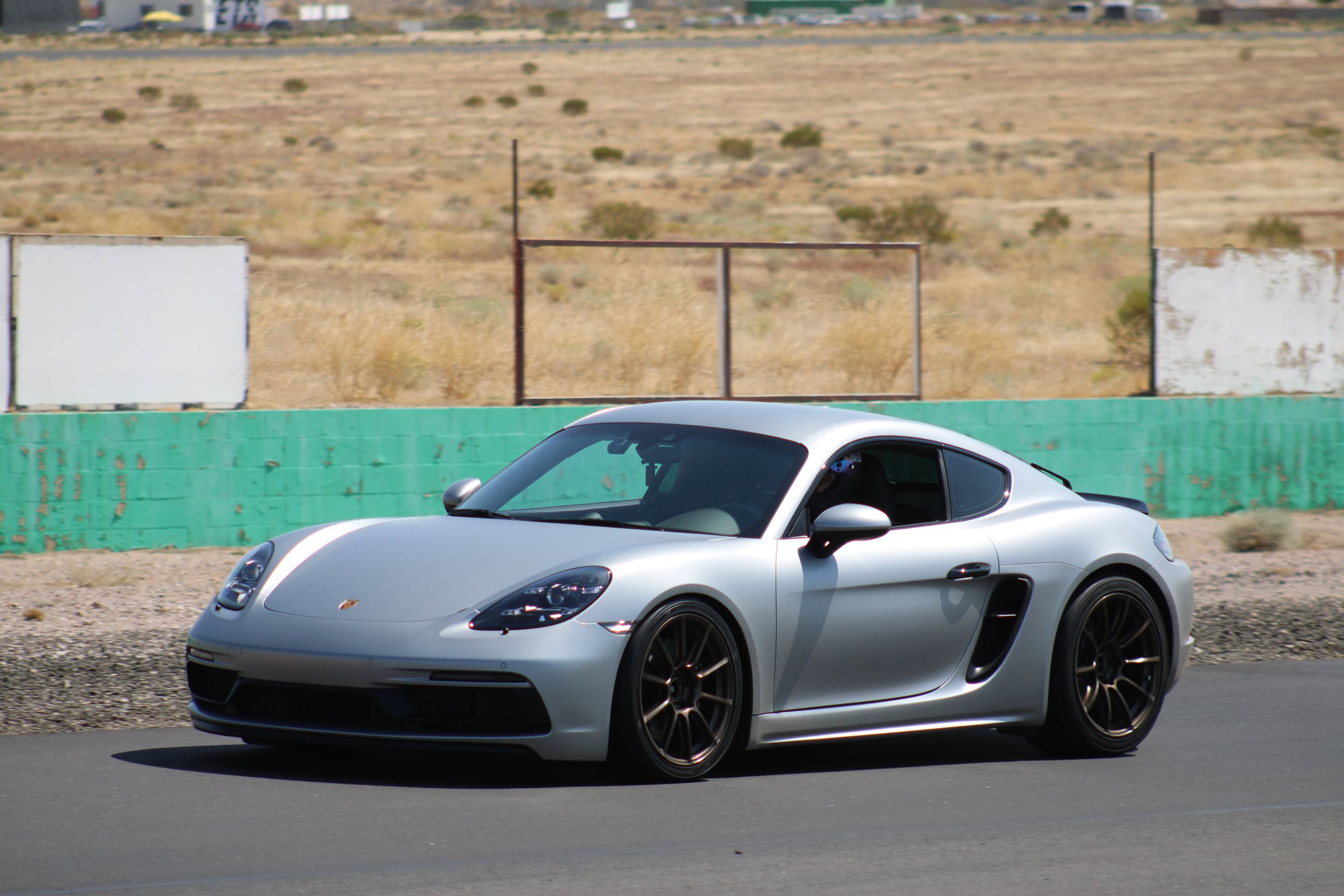 Silver Porsche 718 Cayman GTS 4.0L with 19" SM-10RS Apex wheels in Satin Bronze