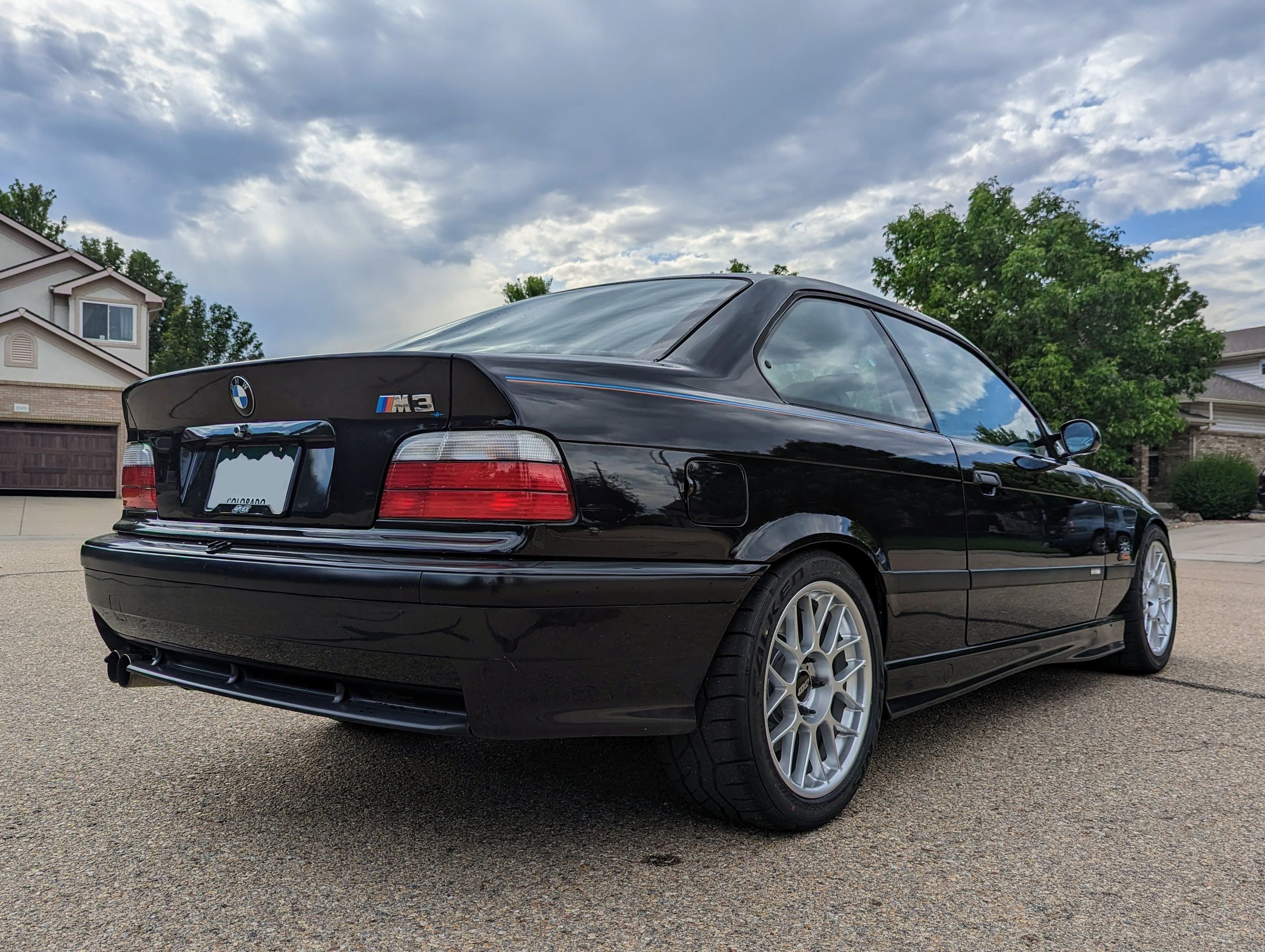 Black BMW E36 M3 with 17" ARC-8 Apex wheels in Hyper Silver