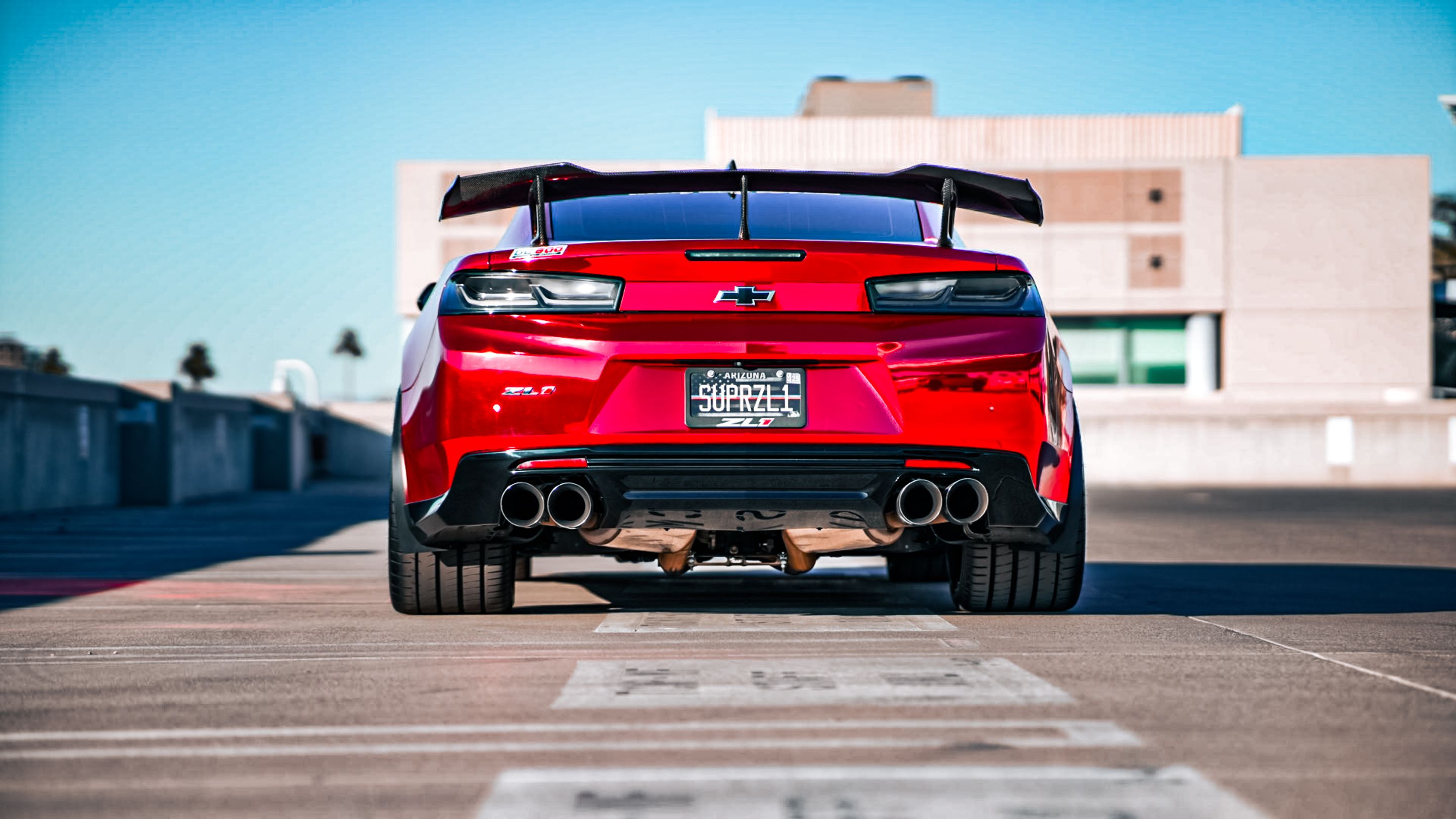 Red Chevrolet 6th Gen Camaro ZL1 with 19" ARC-8 Apex wheels in Anthracite