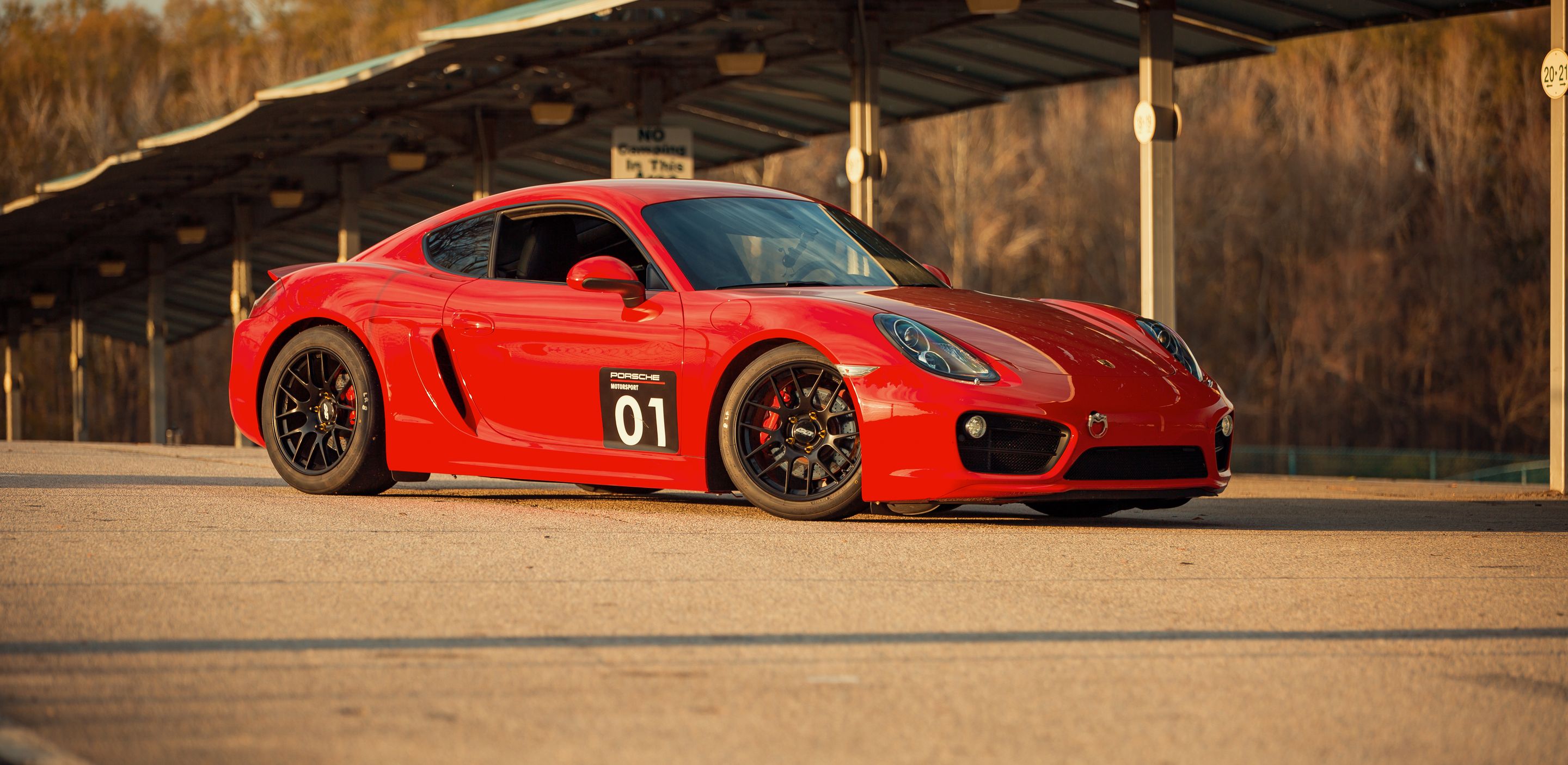 Red Porsche 981 Cayman S with 18" EC-7R Apex wheels in Satin Black