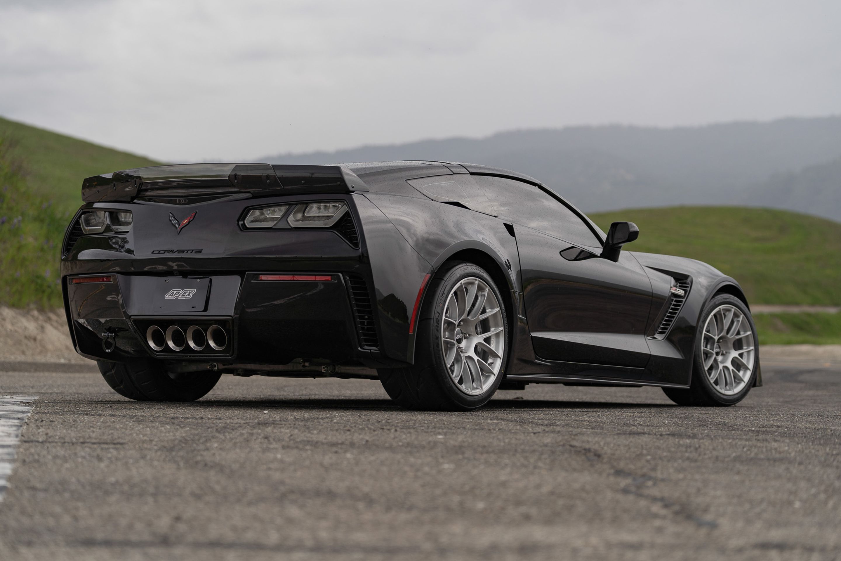 Black Chevrolet C7 Corvette Z06 with 18"/19" EC-7RS Apex wheels in Brushed Clear
