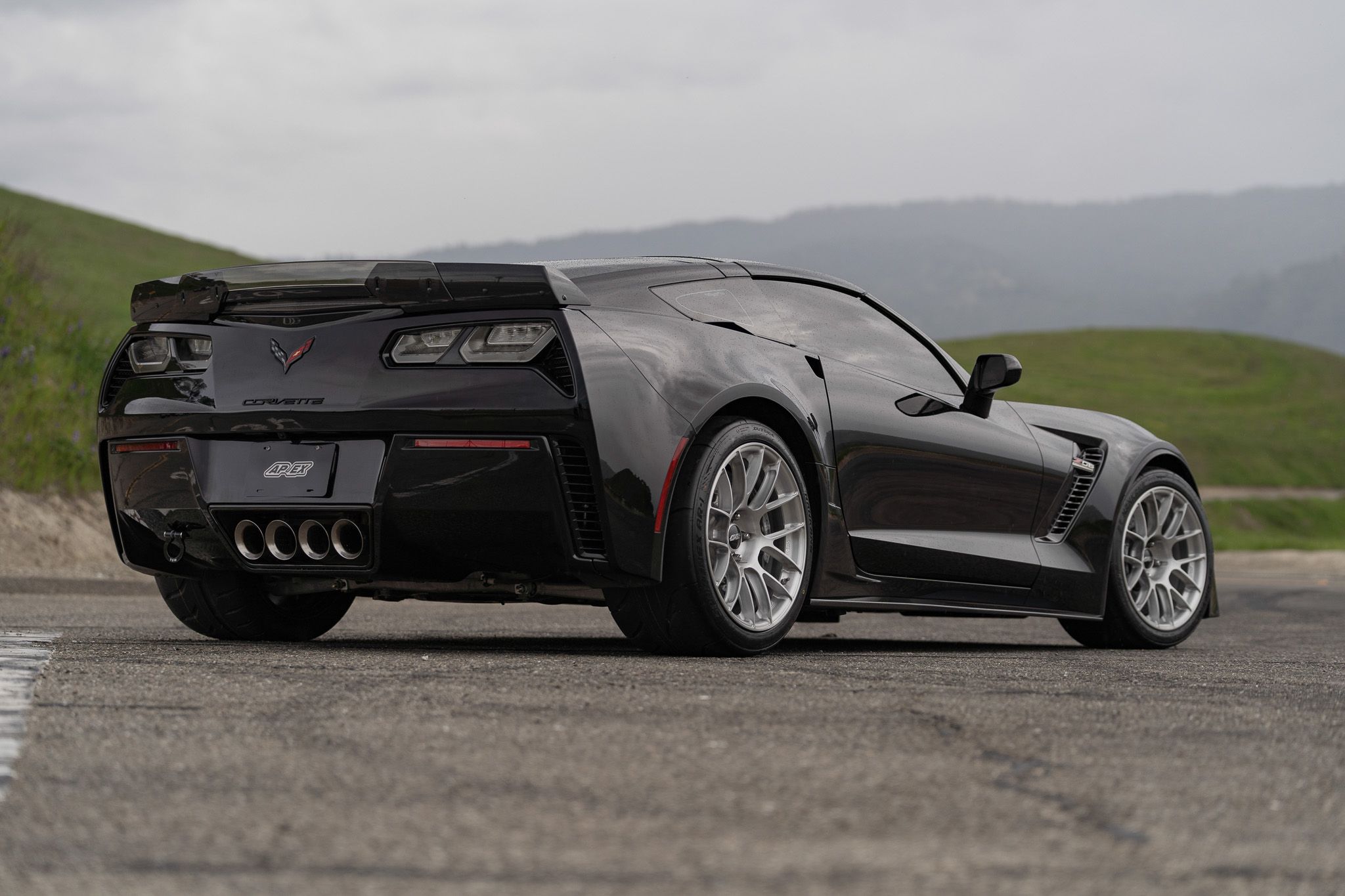 Black Chevrolet C7 Corvette Z06 with 18"/19" EC-7RS Apex wheels in Brushed Clear