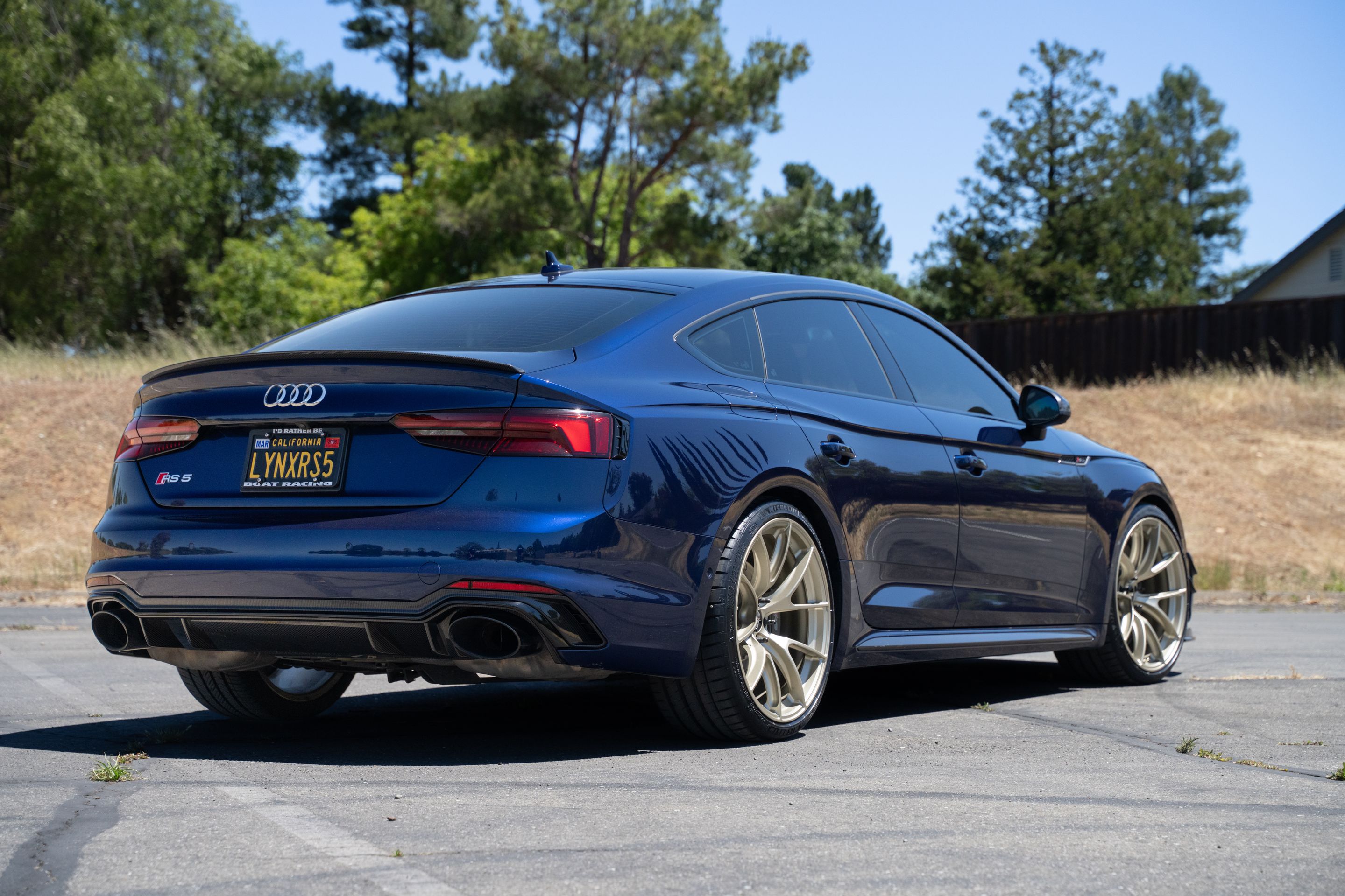 Blue Audi B9 RS 5 Sportback with 20" VS-5RS Apex wheels in Motorsport Gold