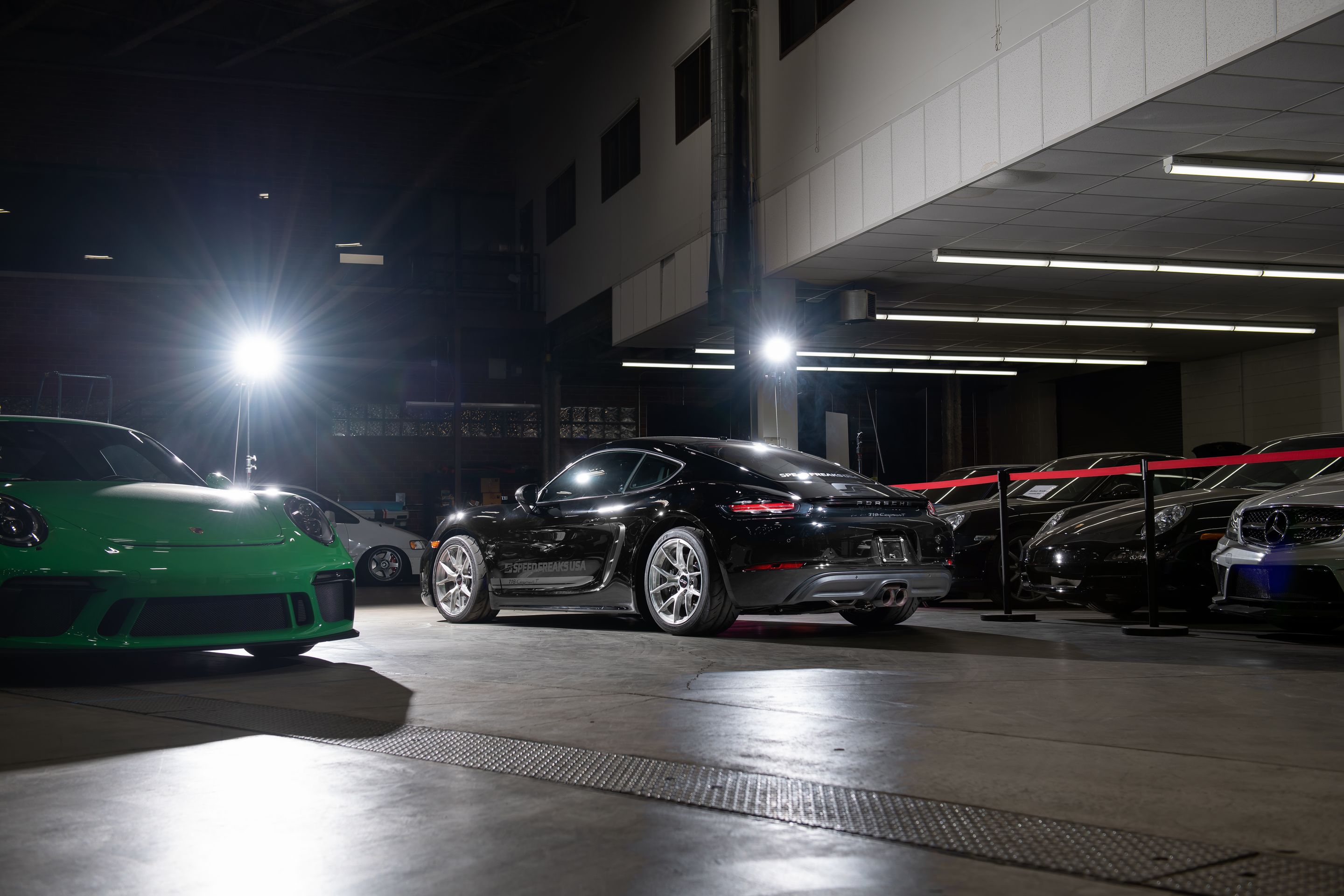 Black Porsche 718 Cayman T with 18" VS-5RS Apex wheels in Brushed Clear