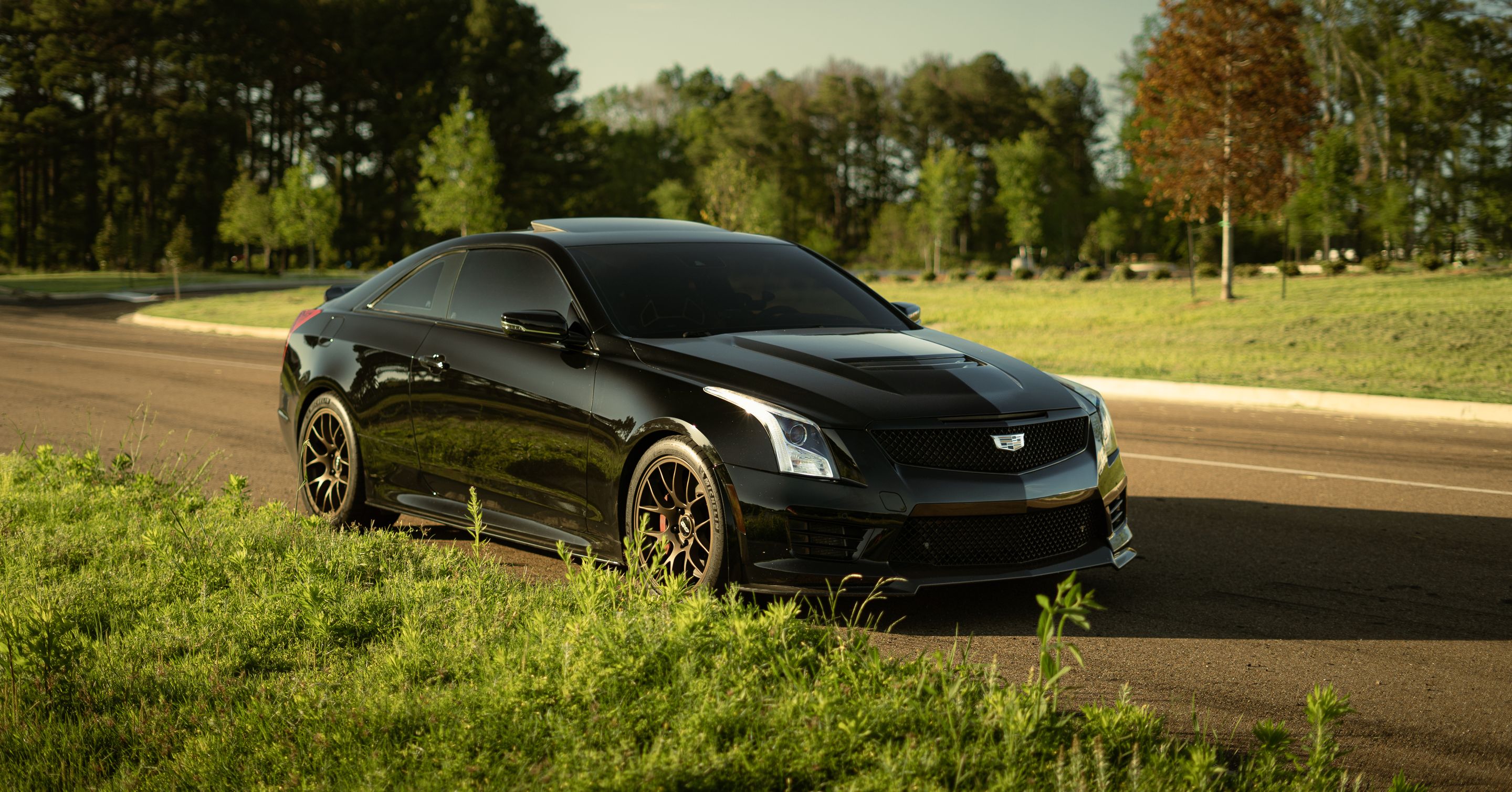 Black Cadillac ATS-V with 18" EC-7 Apex wheels in Satin Bronze
