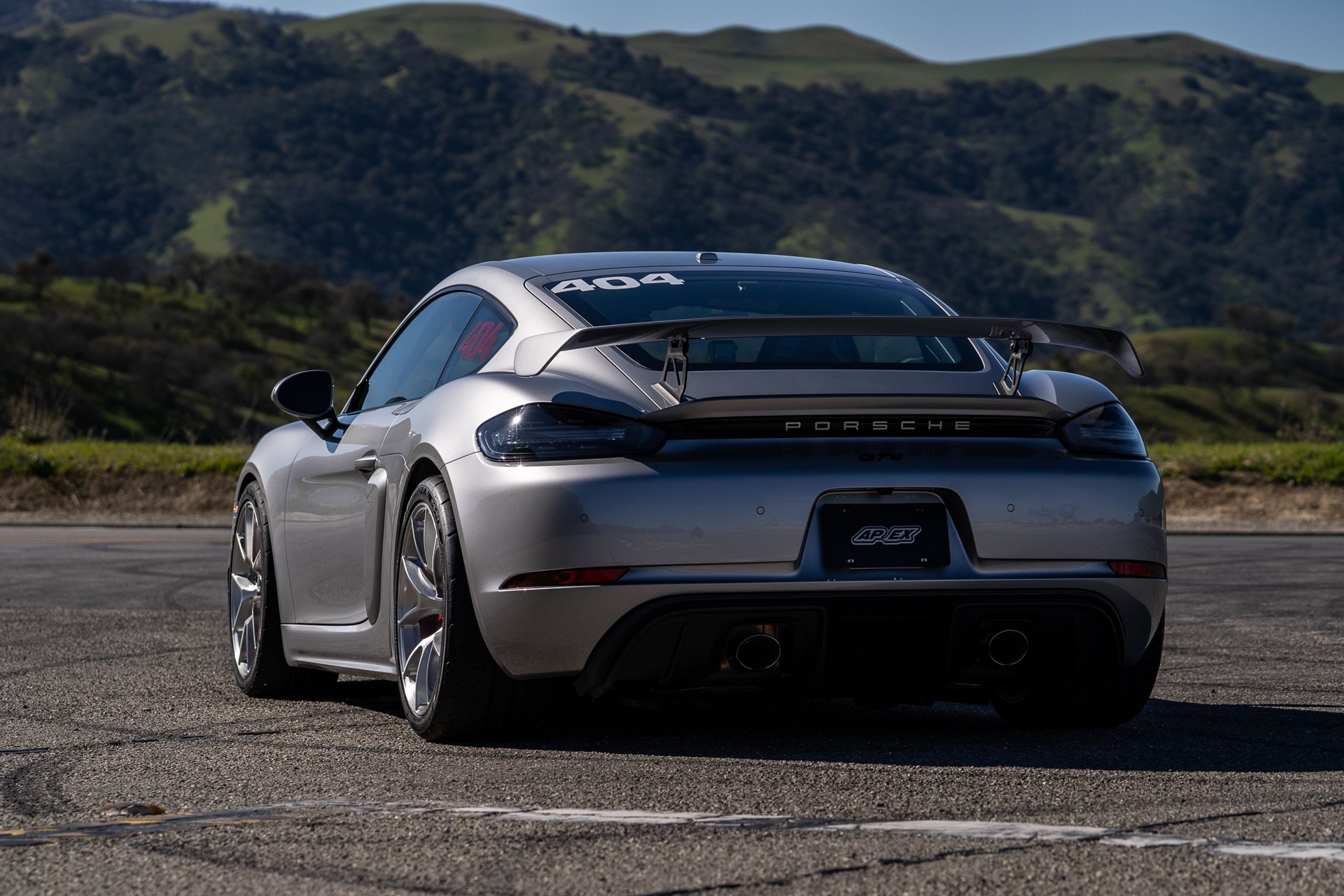 Grey Porsche 718 Cayman GT4 with 19" VS-5RS Apex wheels in Brushed Clear