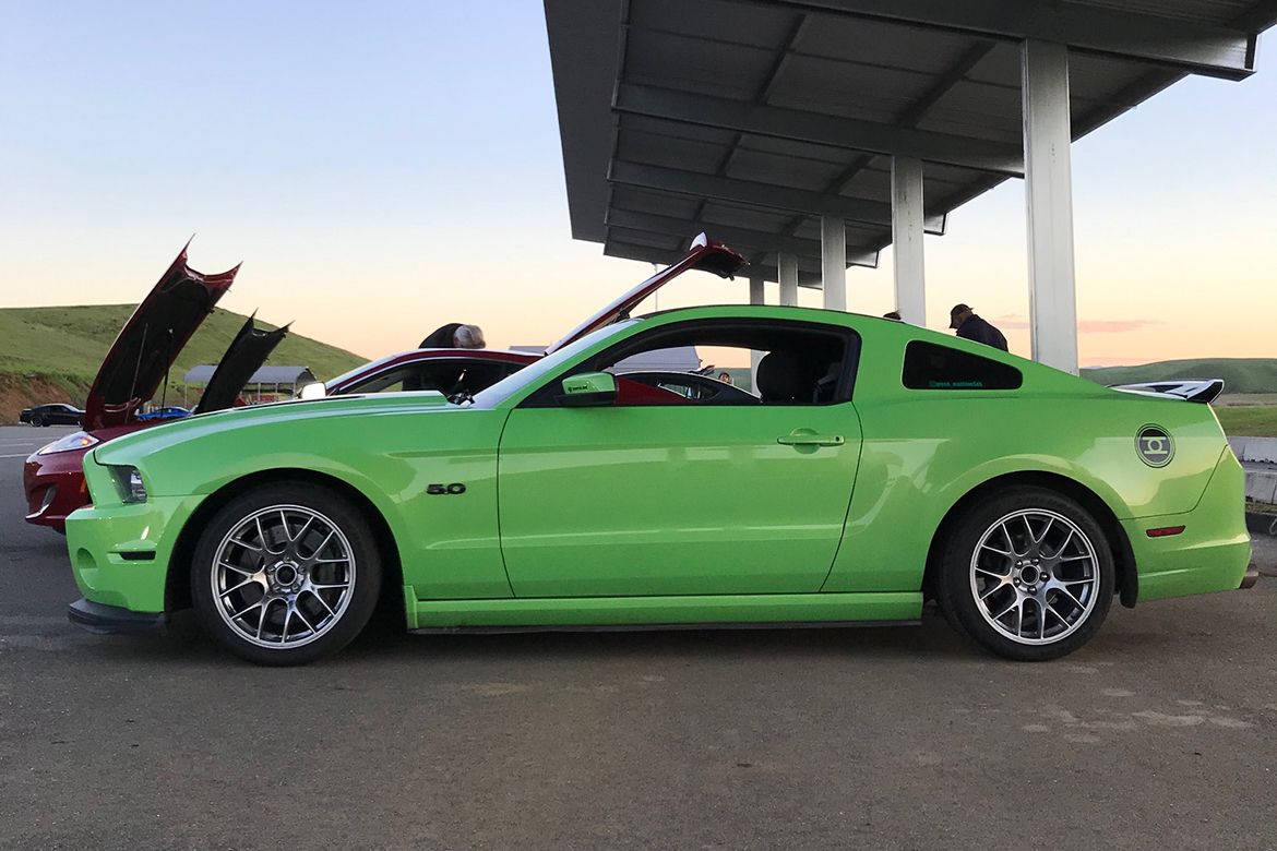 Green Ford S197 Mustang GT with 18" EC-7 Apex wheels in Race Silver