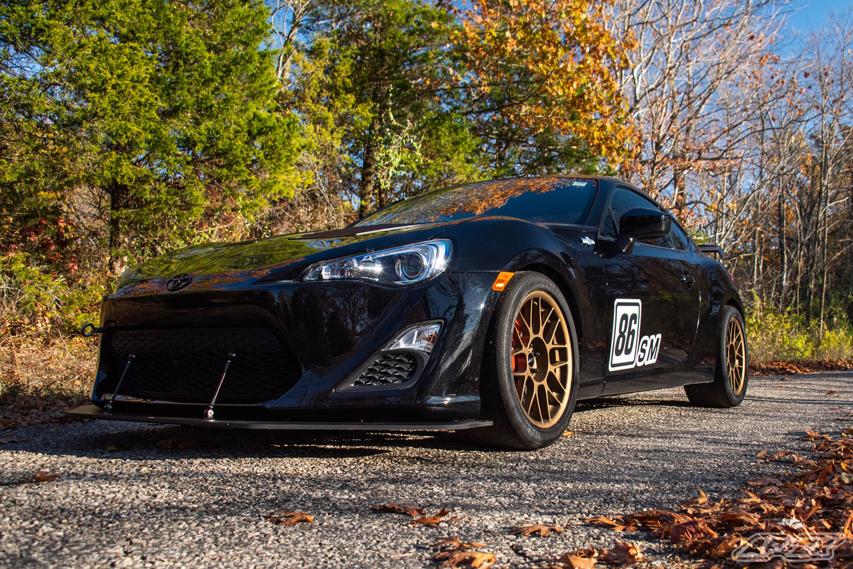 Black Scion FR-S with 17" ARC-8 Apex wheels in Satin Bronze