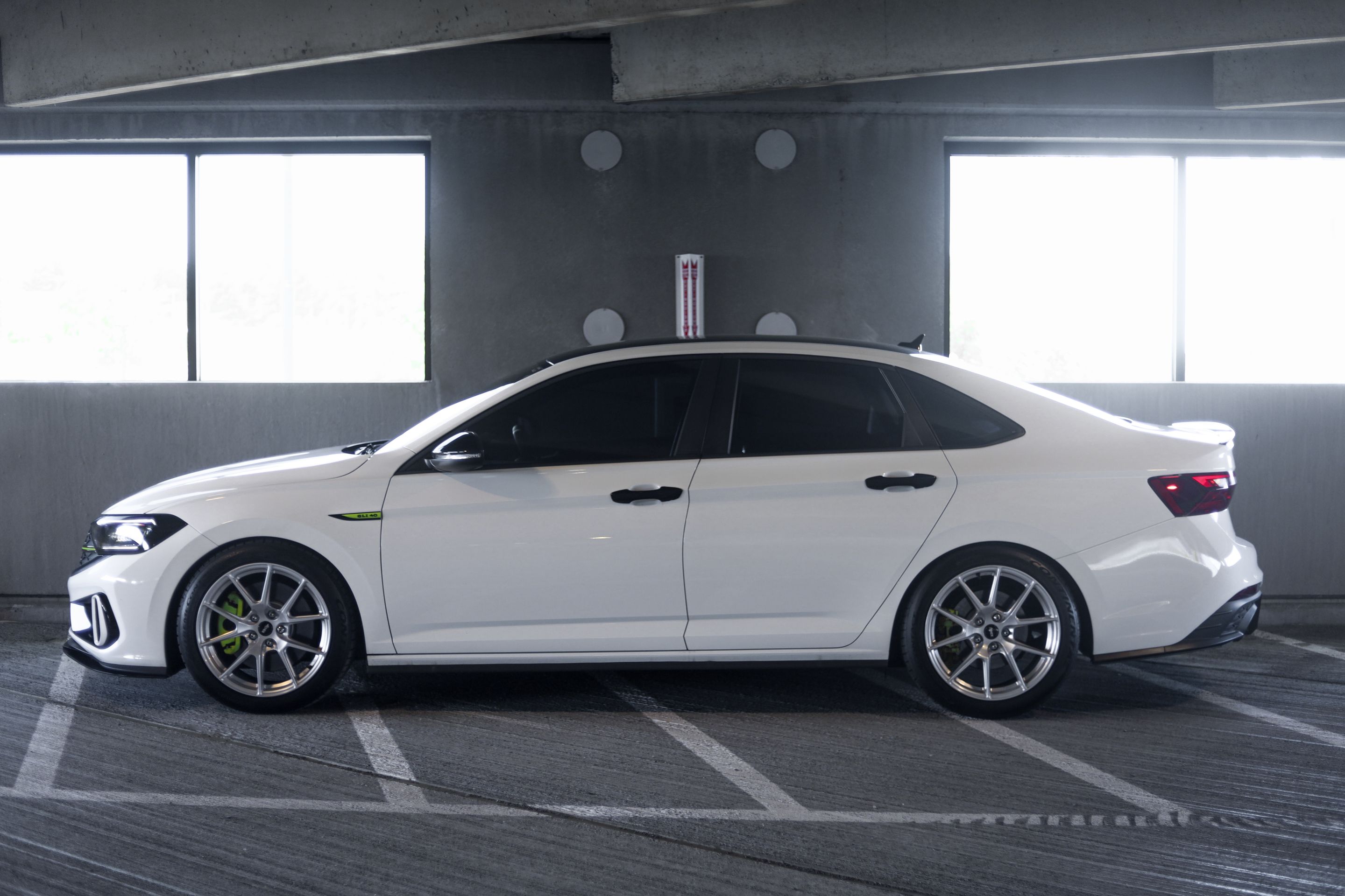 White VW MK7 GLI with 18" VS-5 Apex wheels in Race Silver