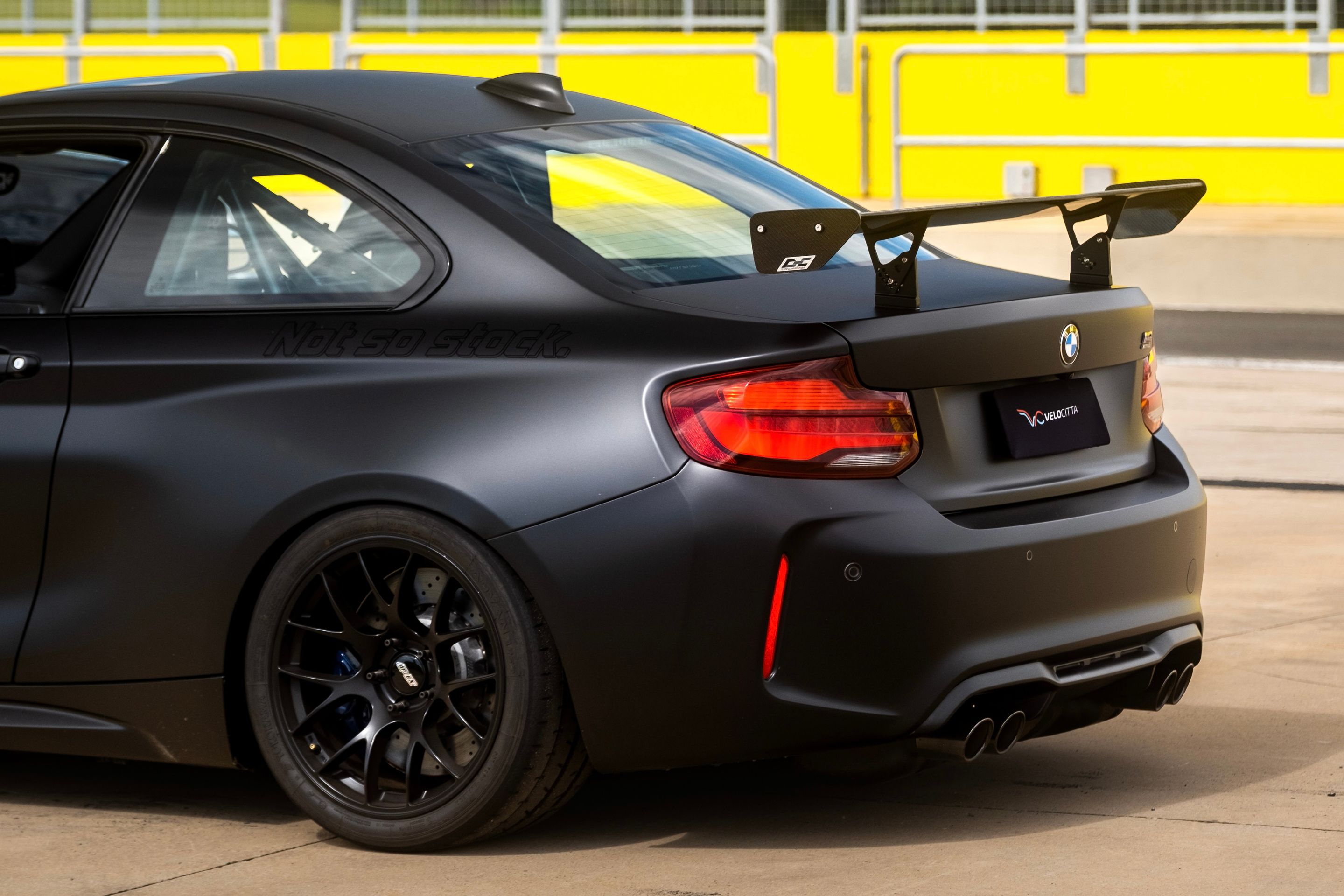 Black BMW F87 M2 with 18" EC-7 Apex wheels in Satin Black