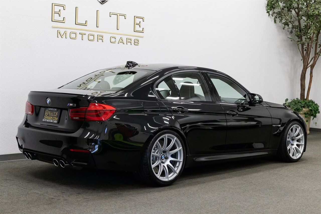 Black BMW F80 M3 with 19" SM-10 Apex wheels in Race Silver