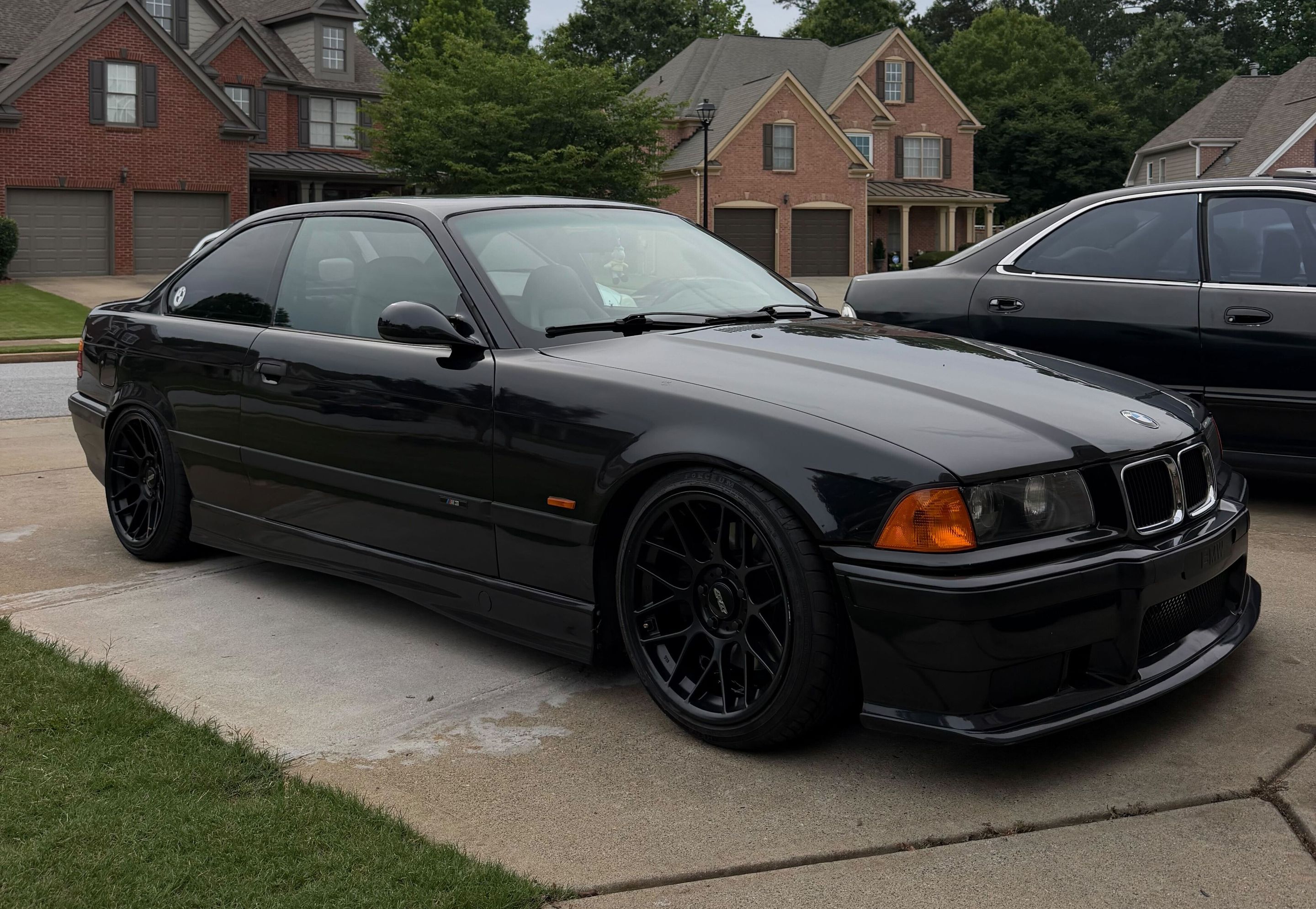Black BMW E36 M3 with 17" ARC-8 Apex wheels in Satin Black