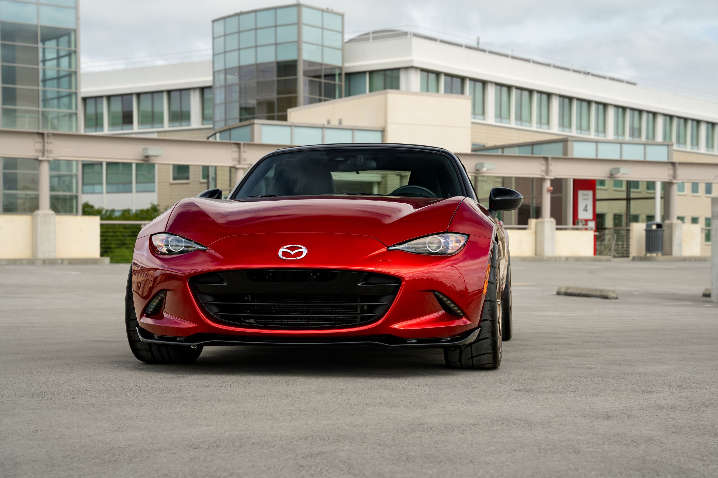 Red Mazda ND MX-5 Miata with 17" SM-8RS Apex wheels in Satin Bronze